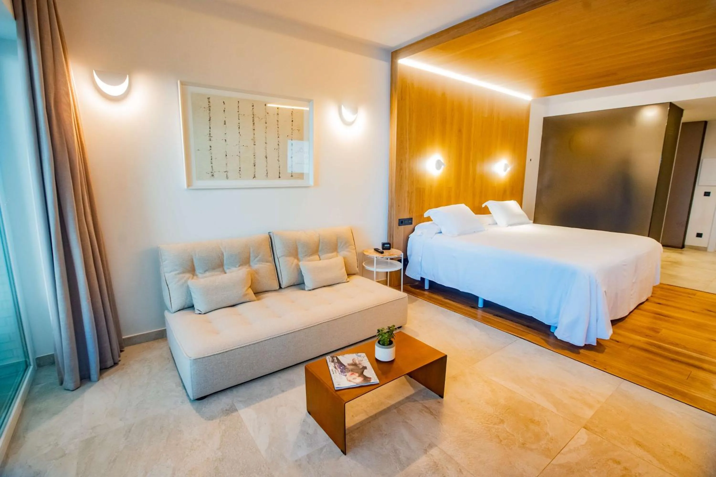 Living room, Bed in Higuerón Hotel Málaga, Curio Collection by Hilton