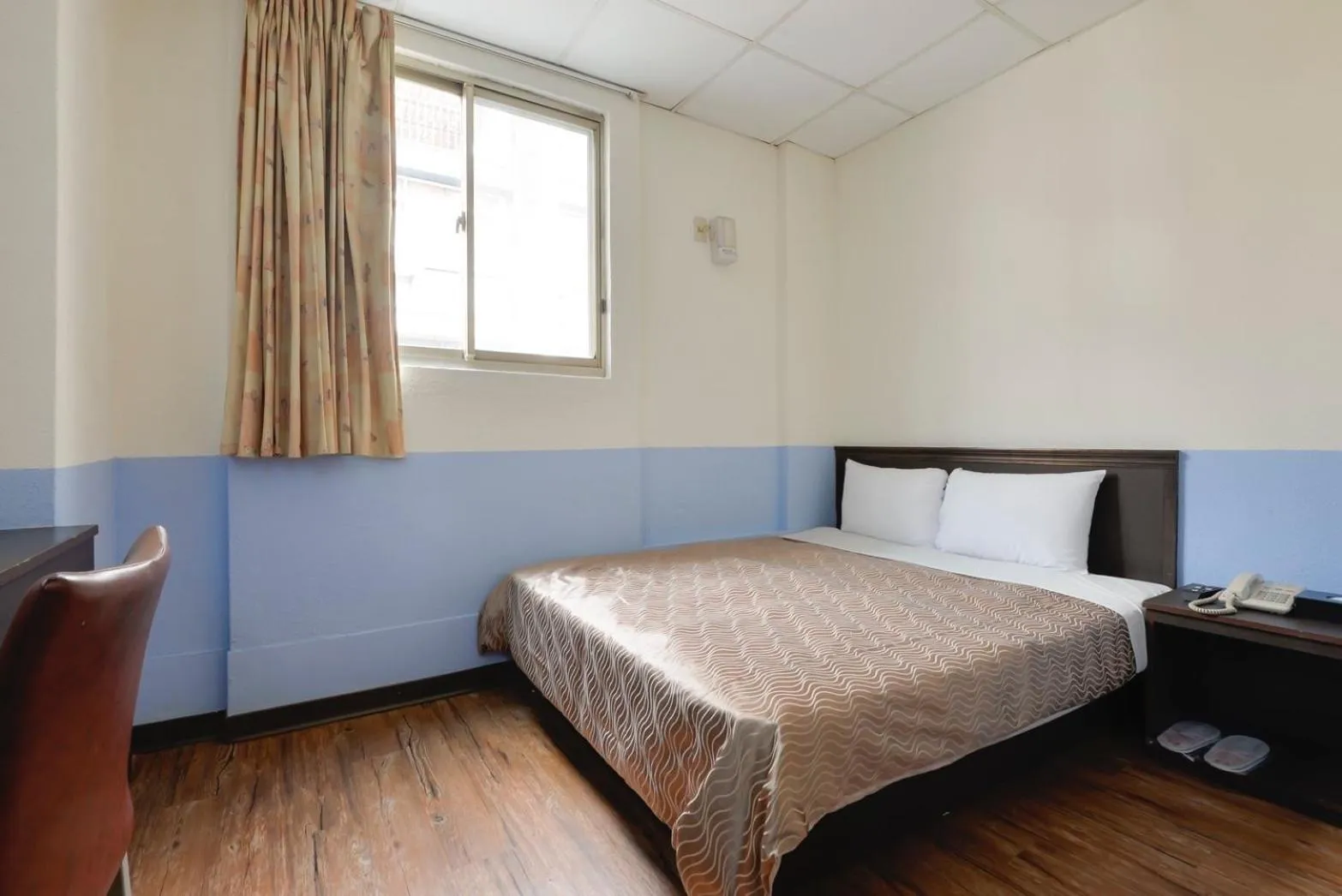 Bed in Blue Ocean Hotel