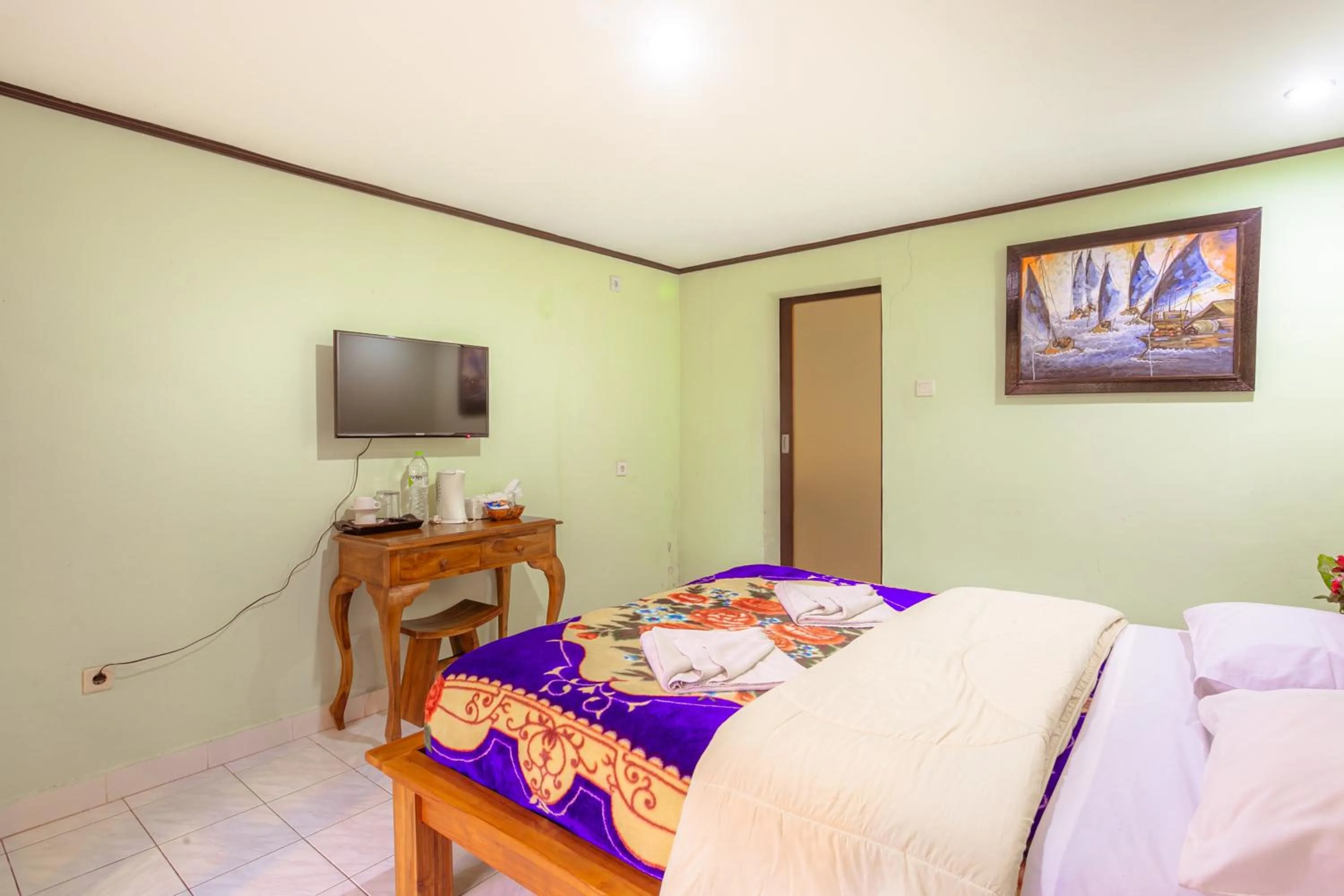 Communal lounge/ TV room, Bed in Pacung Indah Hotel & Restaurant by ecommerceloka