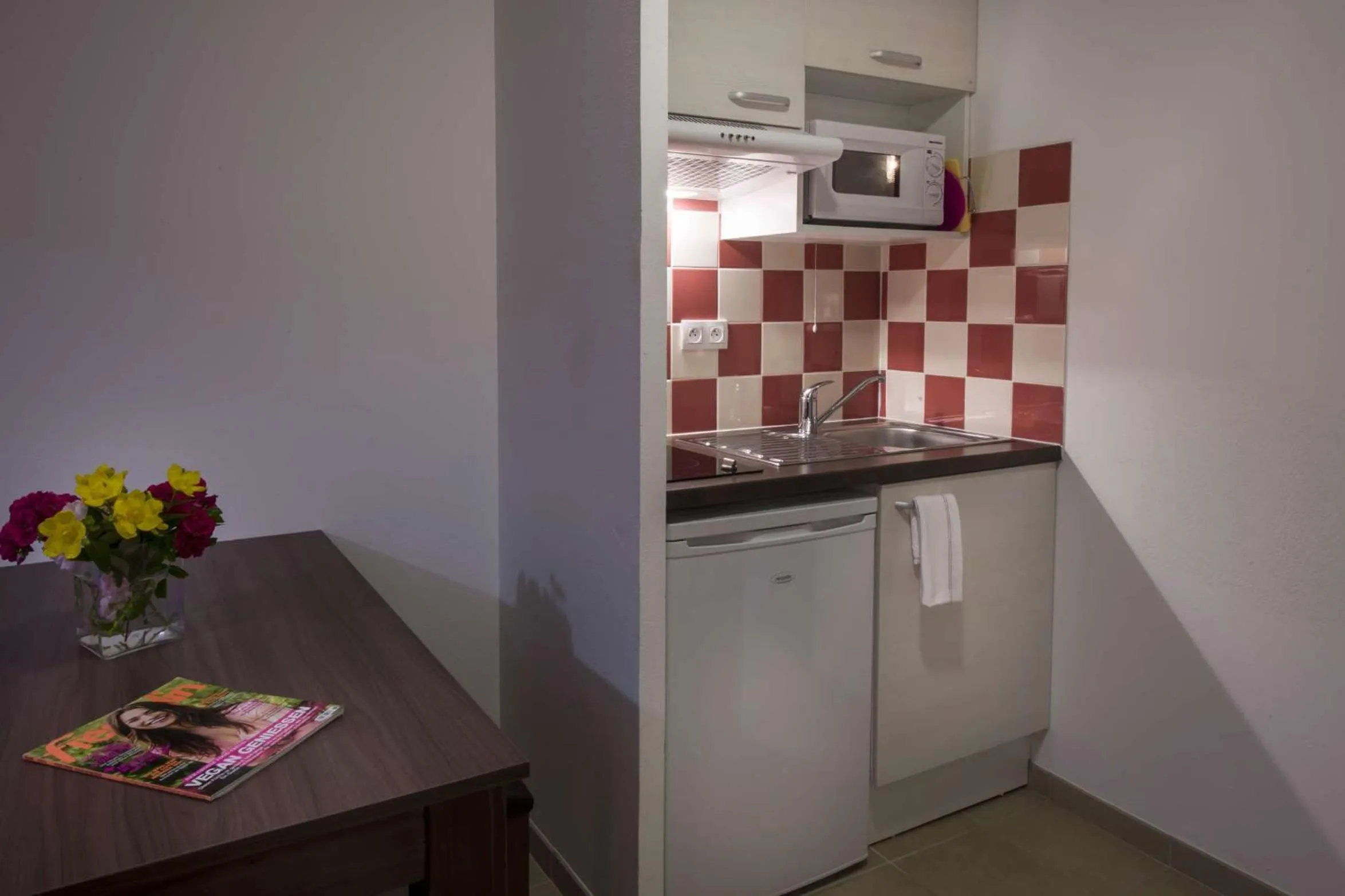 Kitchen or kitchenette in Vacancéole - Résidence Le Clos du Rocher