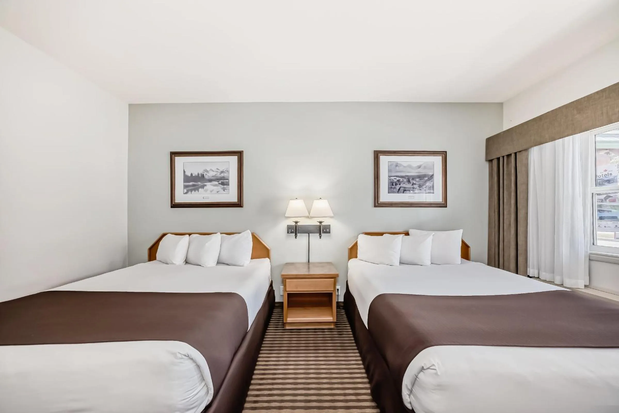 Bed in Canmore Rocky Mountain Inn