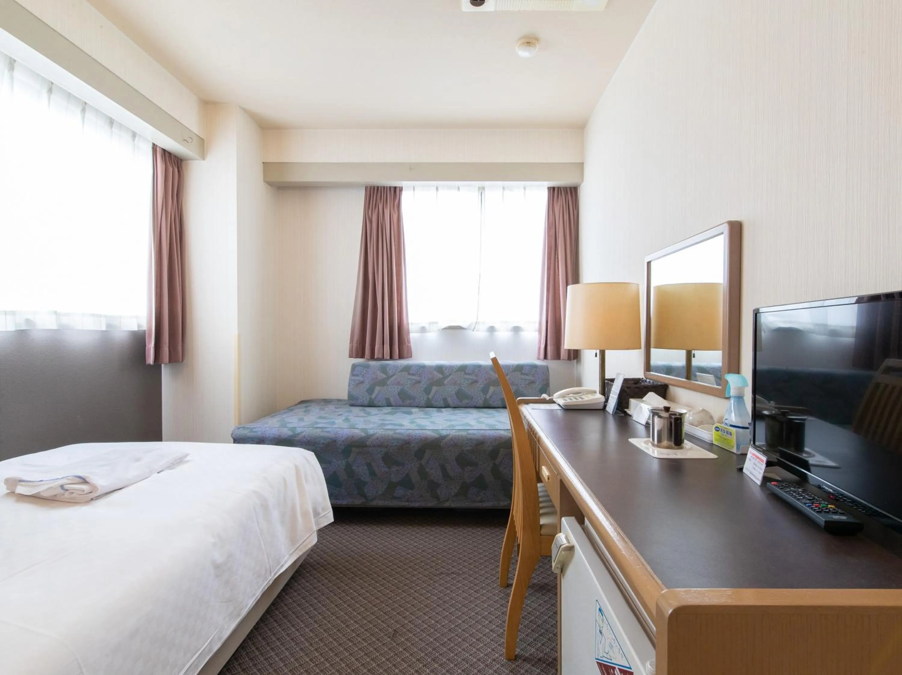 Bed in Nagasaki Orion Hotel