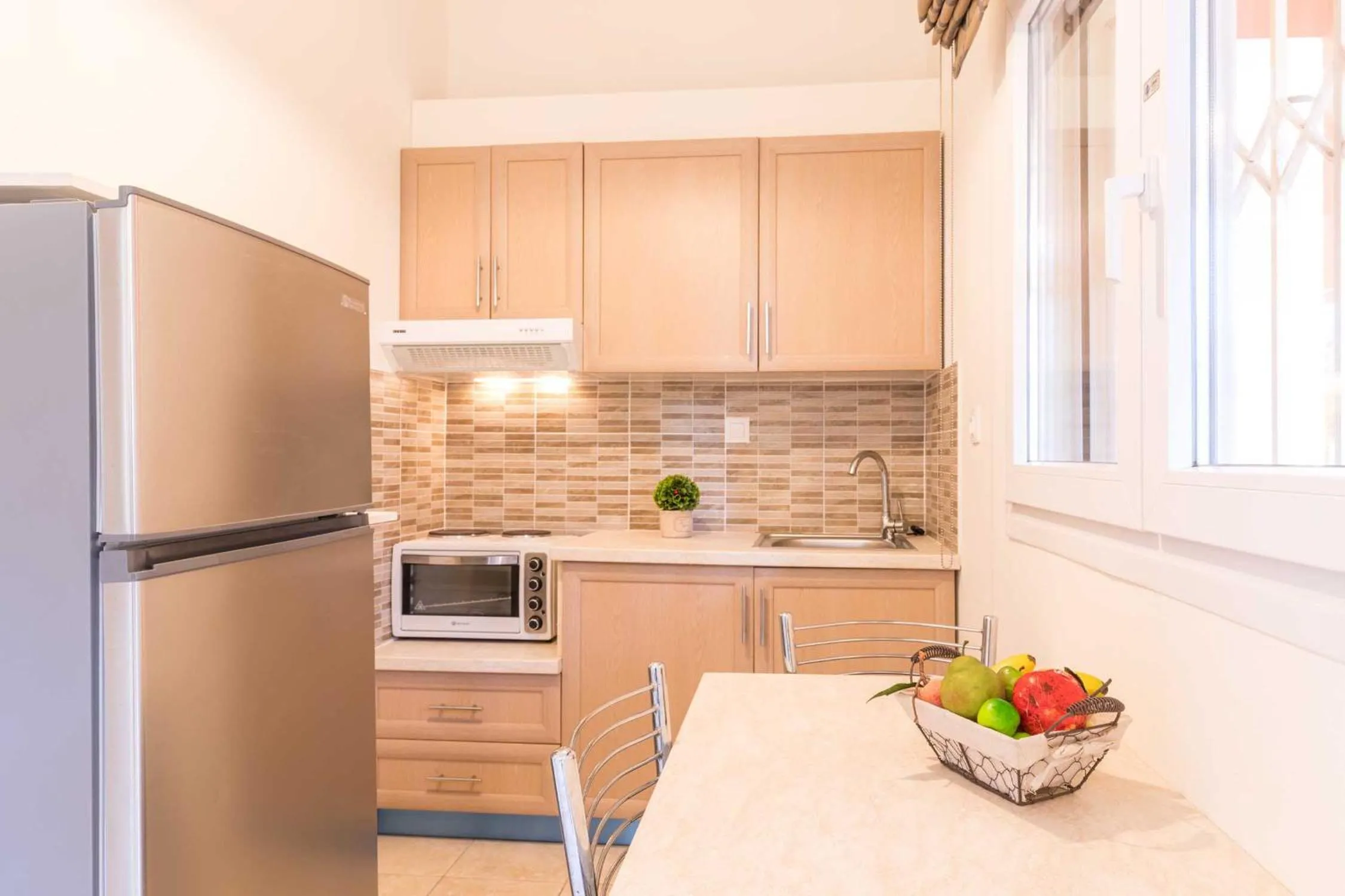 Kitchen or kitchenette in BELLA De LUX APTS