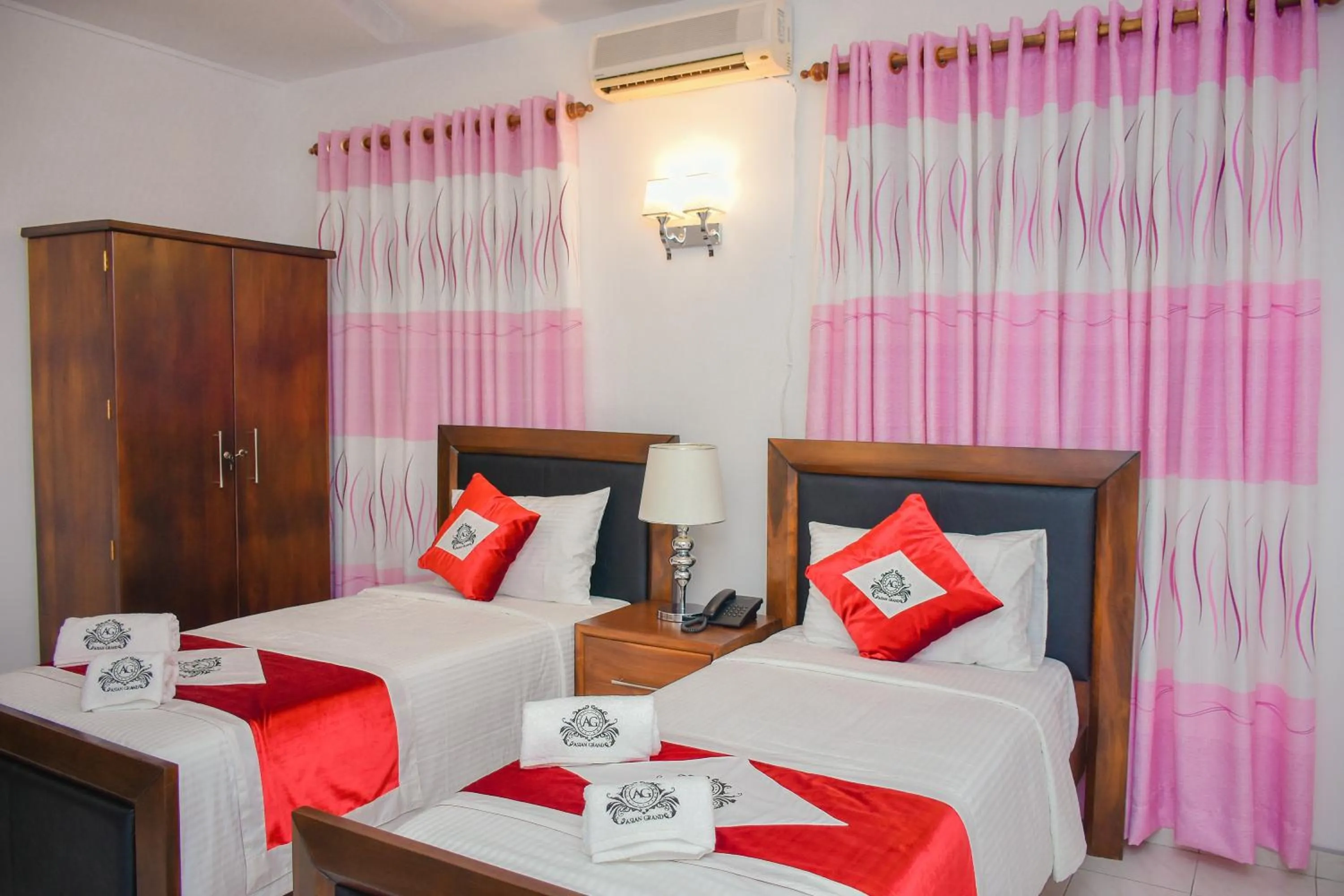 Bed in Asian Grand Hotel