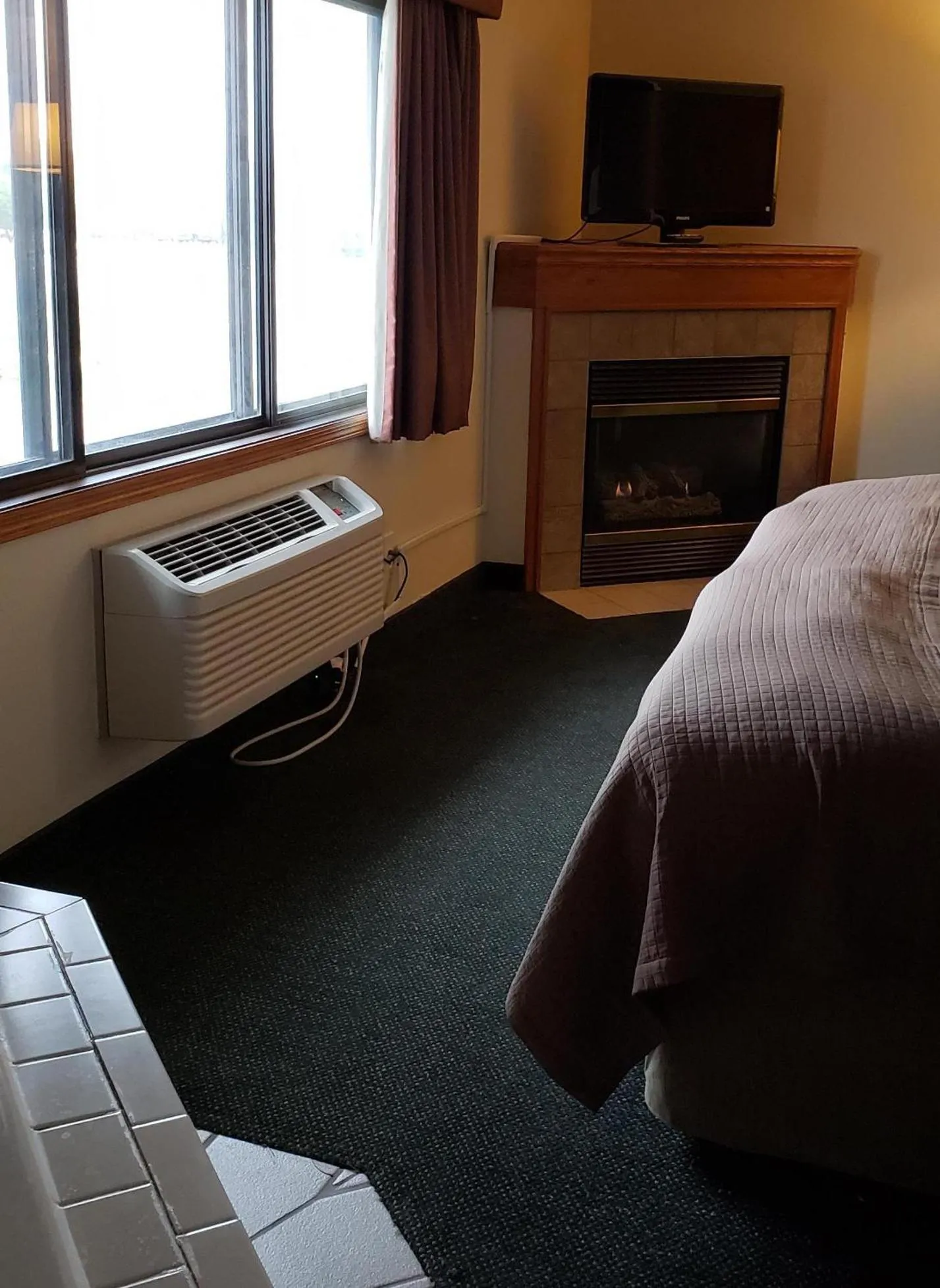 Bed in AmericInn by Wyndham Kearney