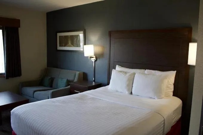 Bed in AmericInn by Wyndham Kearney