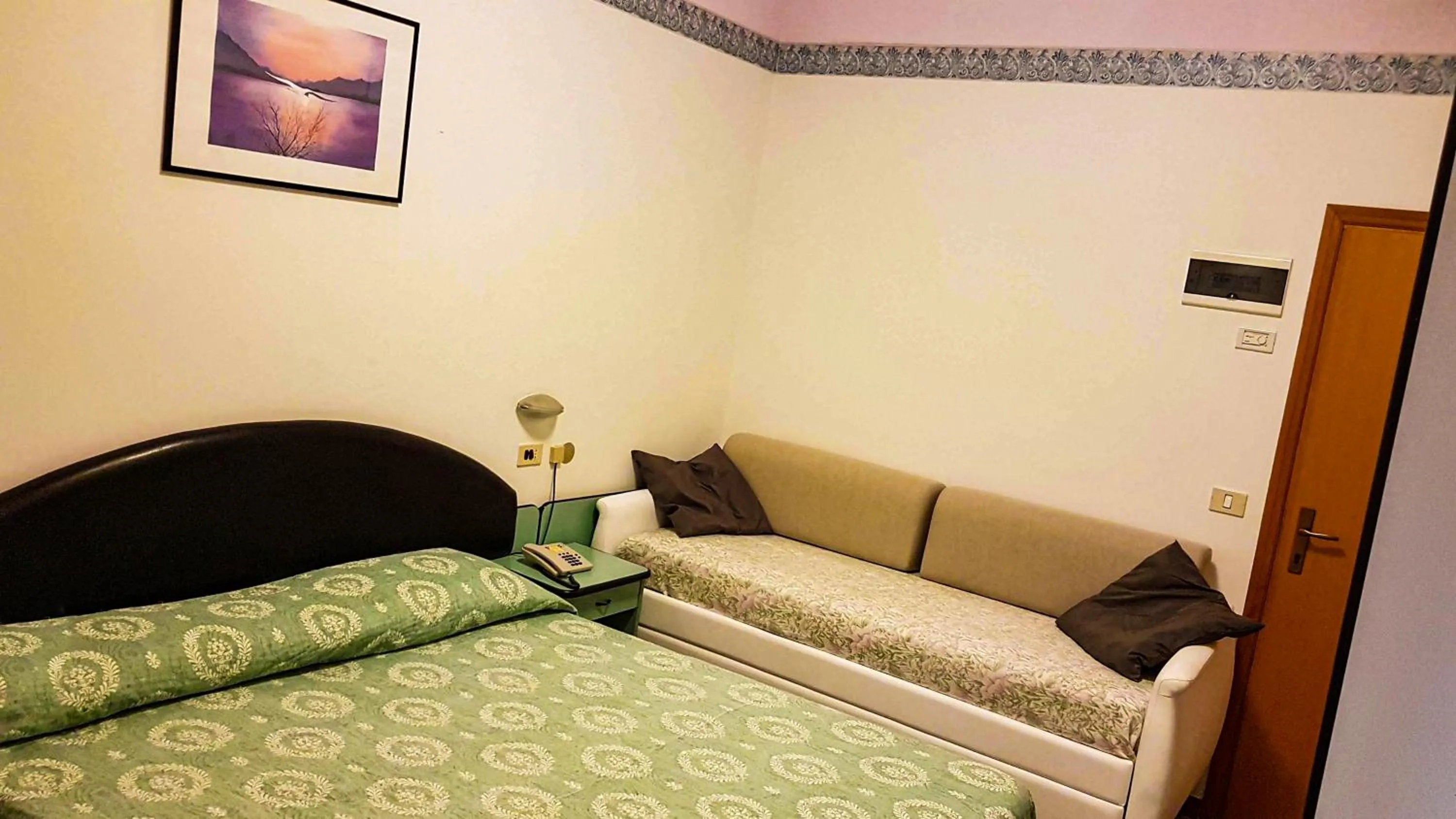 Bed in Hotel Cavalluccio Marino