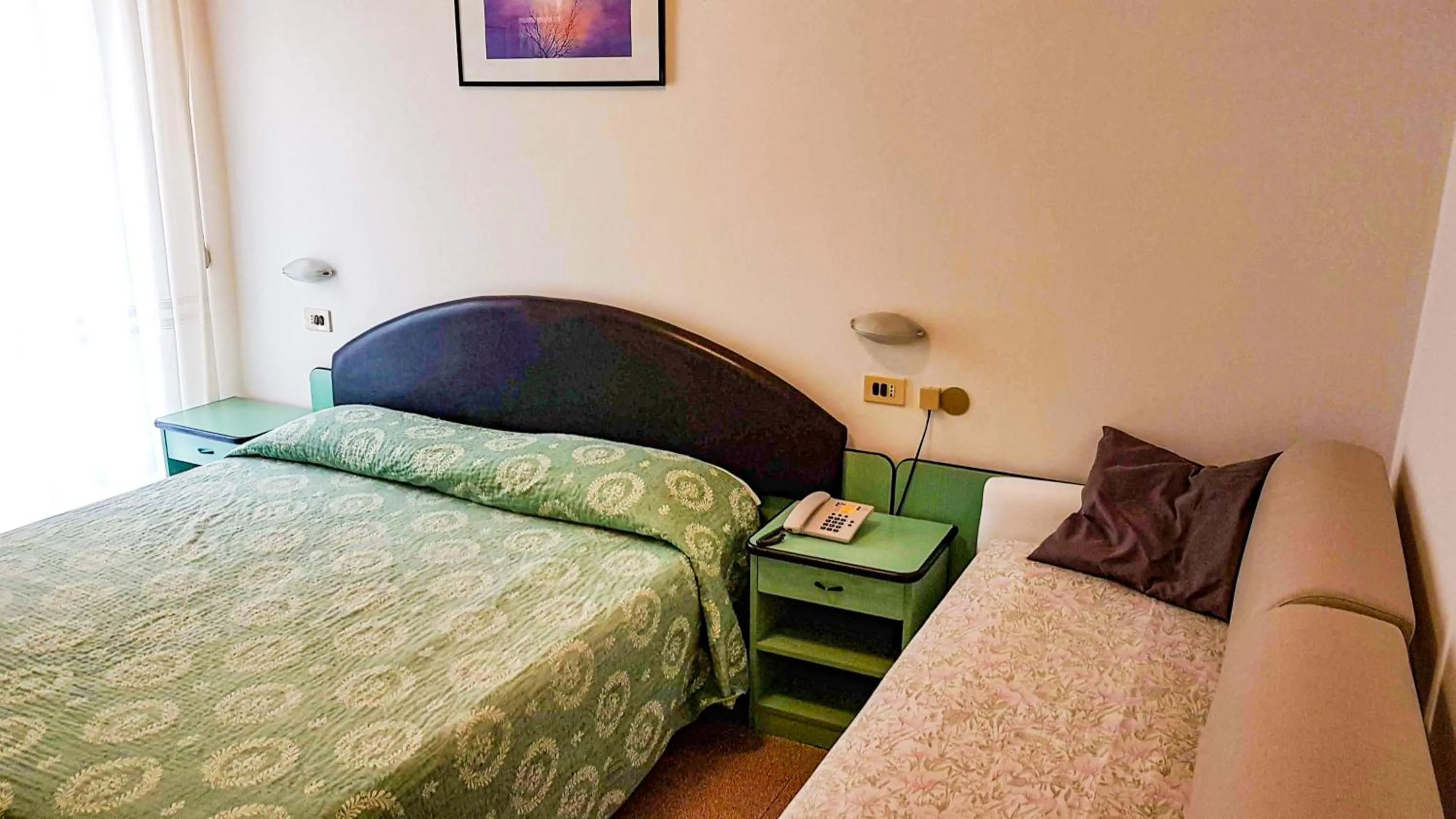 Bed in Hotel Cavalluccio Marino