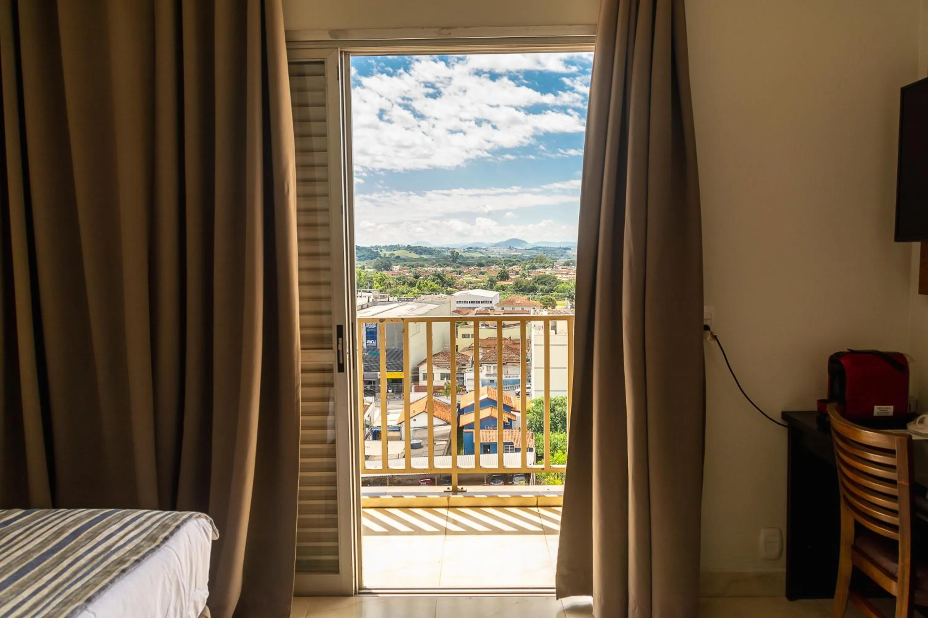 View (from property/room), Bed in Fenix Hotel Pouso Alegre