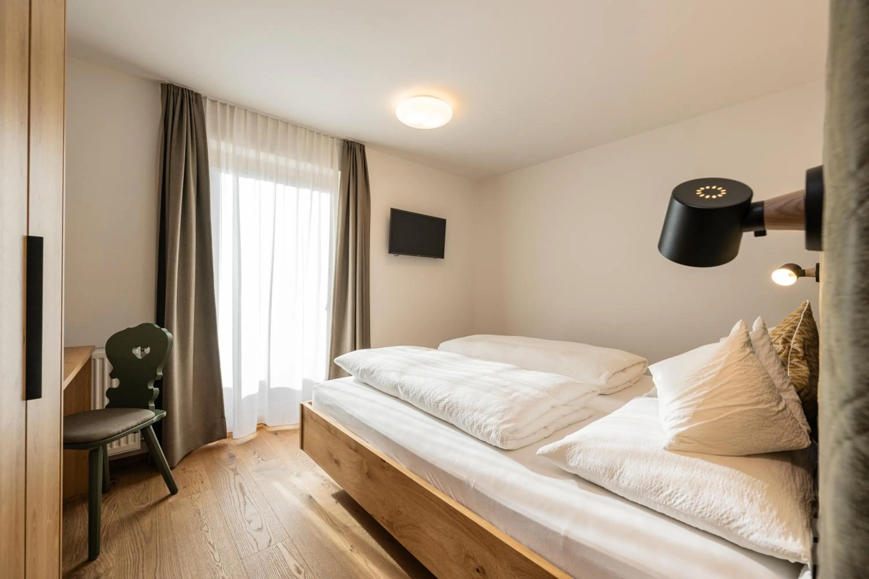 Bed in Gasthof Albergo Dolomiten