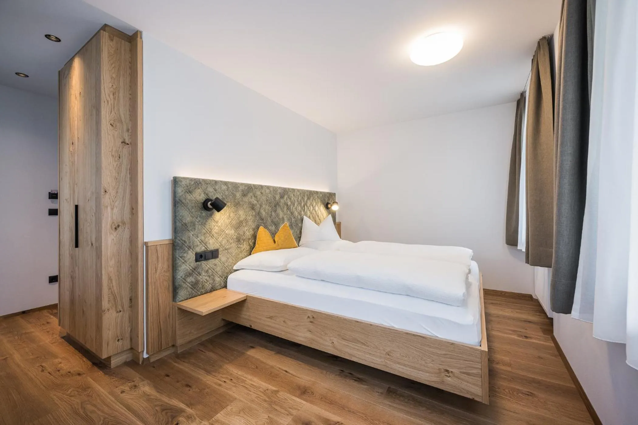 Bed in Gasthof Albergo Dolomiten