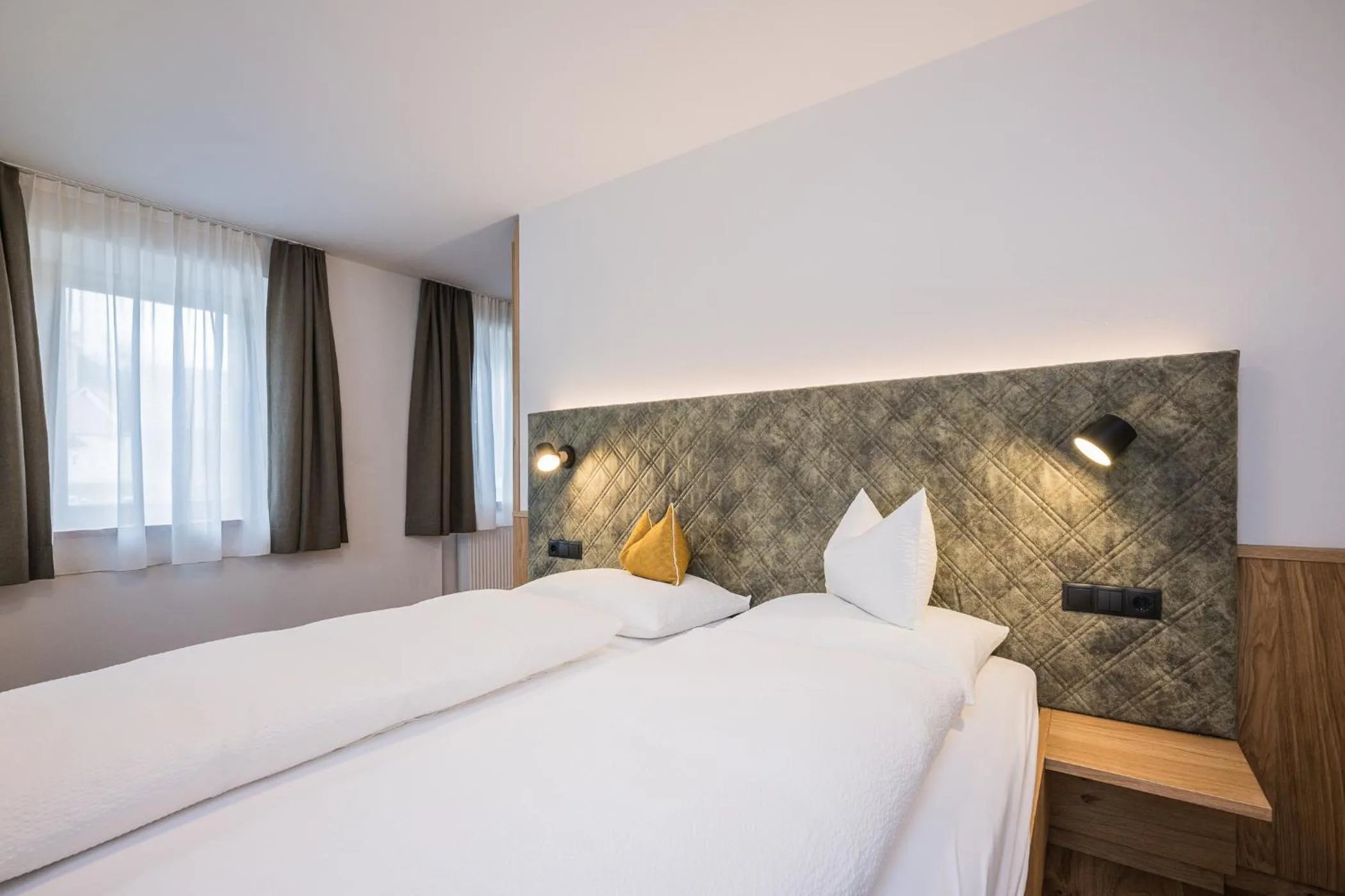 Bed in Gasthof Albergo Dolomiten