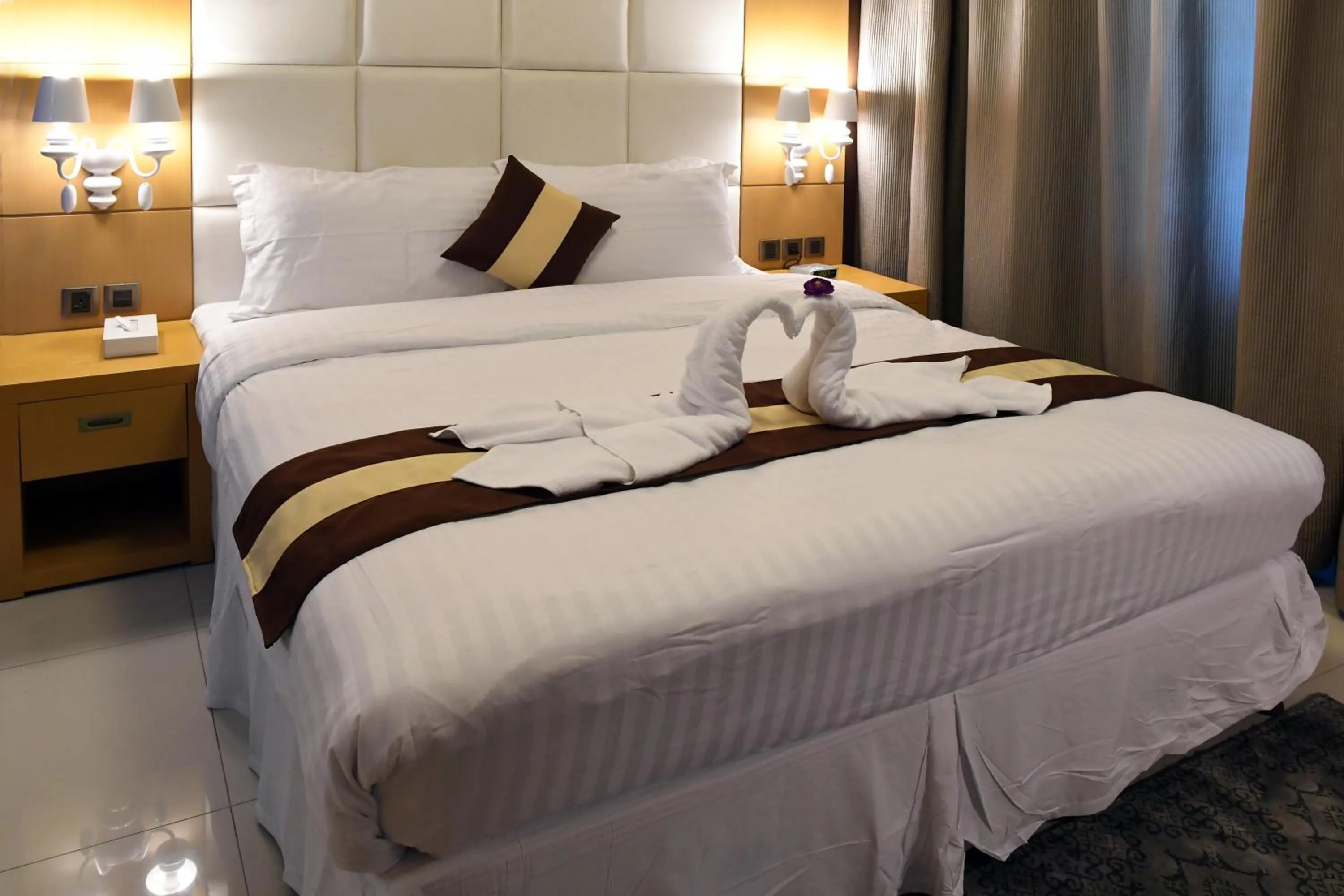 Bed in Al Olaya Suites Hotel