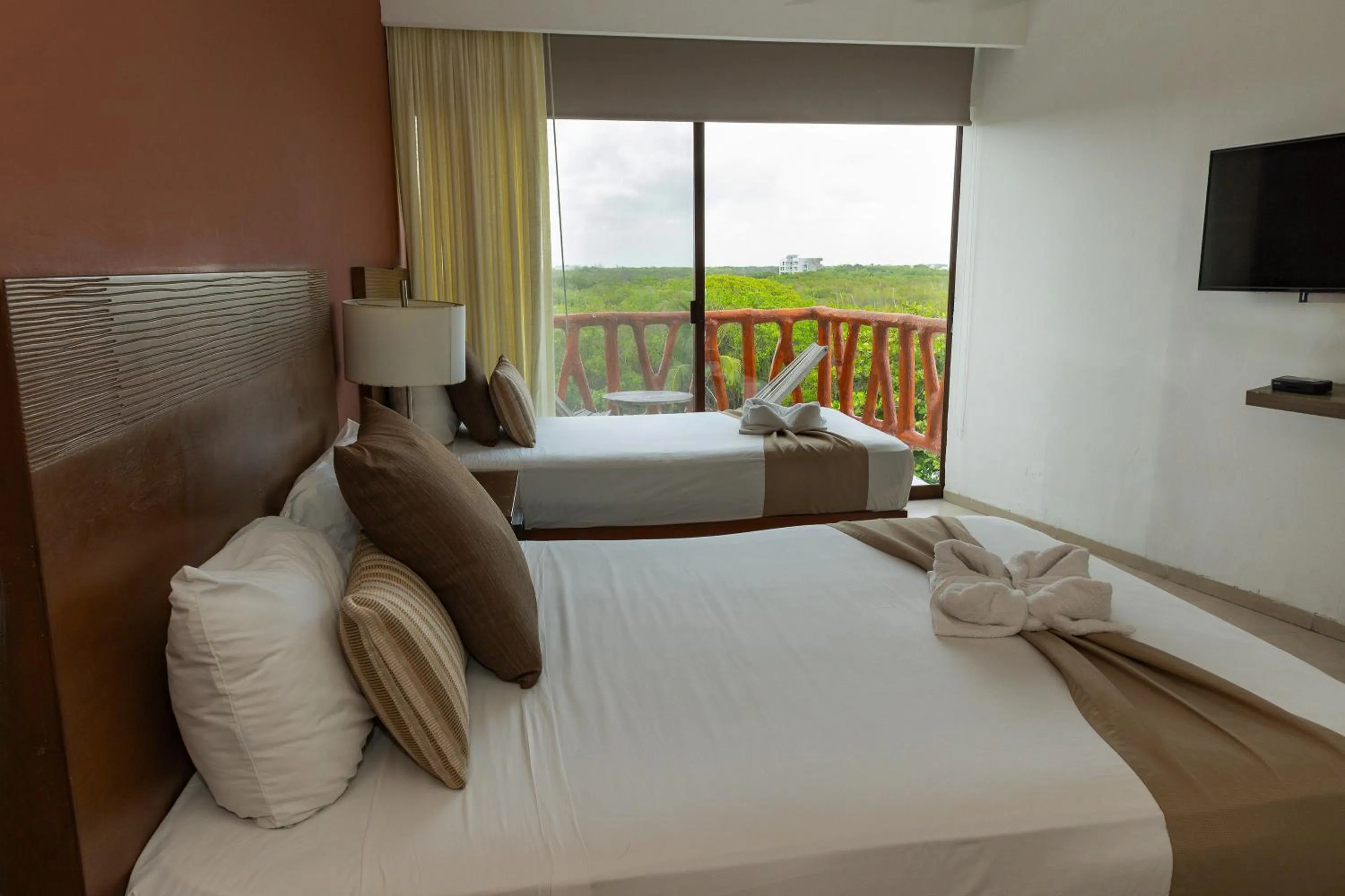Bed in Quinto Sole Boutique Hotel Mahahual