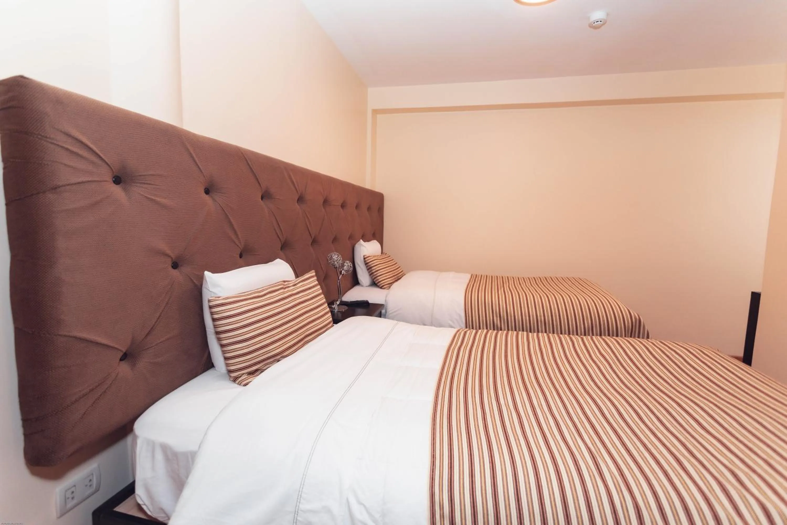 Bed in Hotel Las Quenas