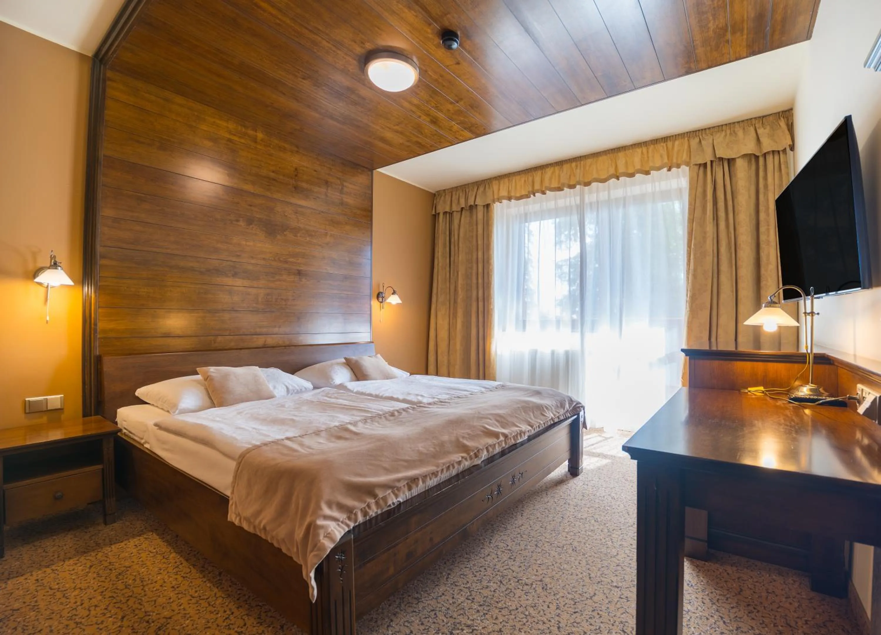 Photo of the whole room, Bed in APLEND Wellness Hotel Borovica