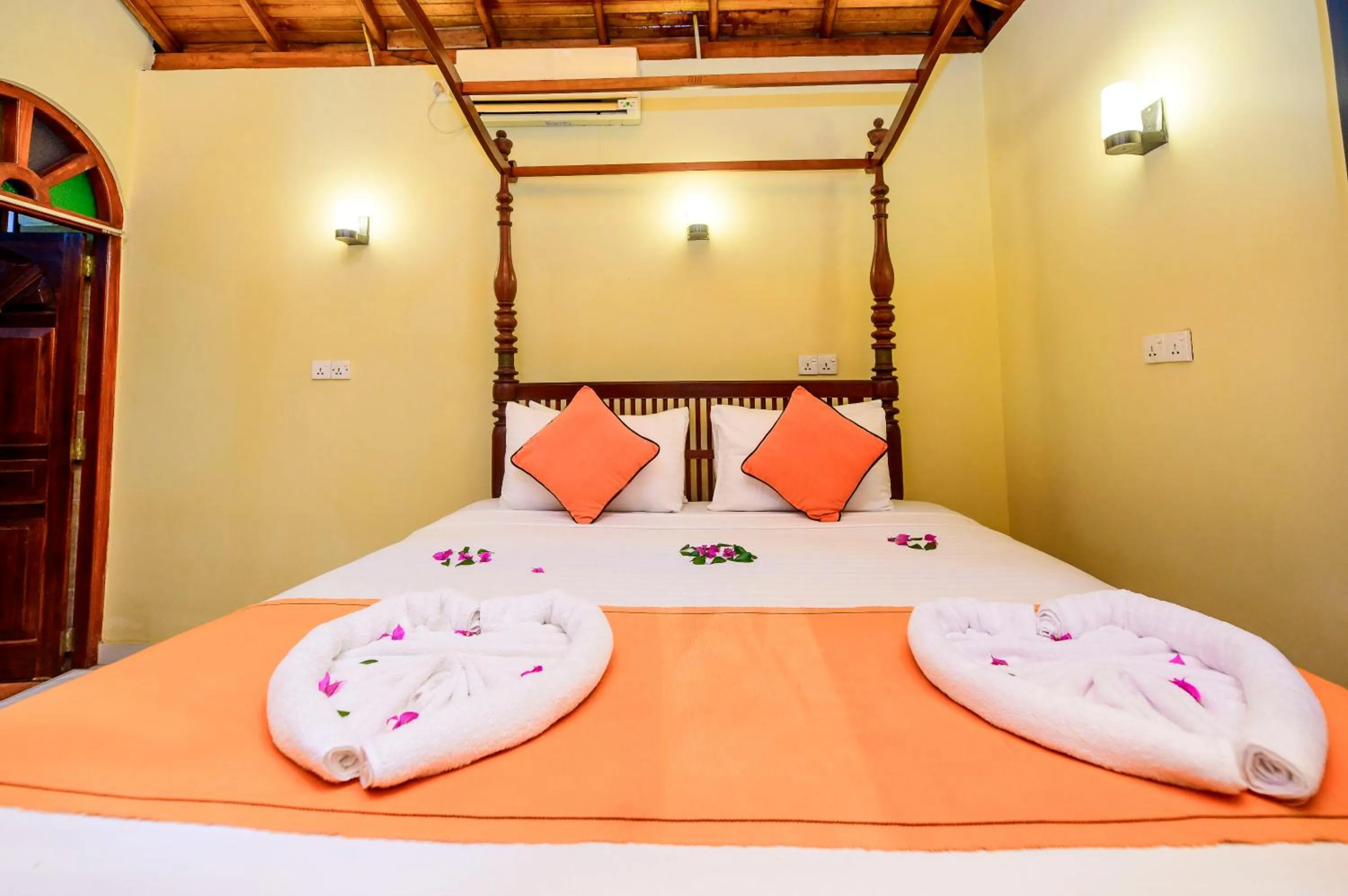 Bed in Royal Beach Hotel Hikkaduwa