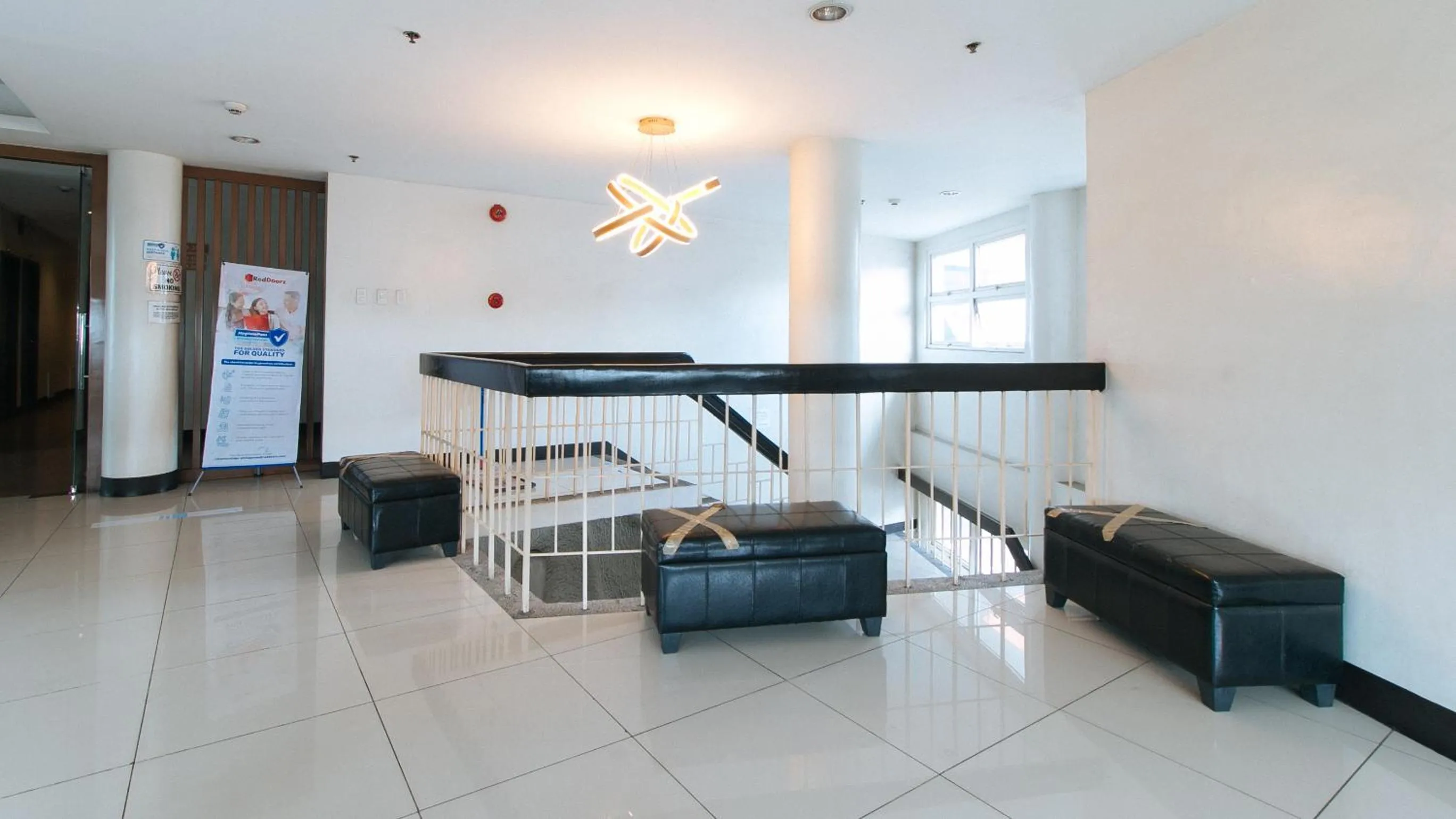 Seating area in RedDoorz Plus at EDSA Congressional