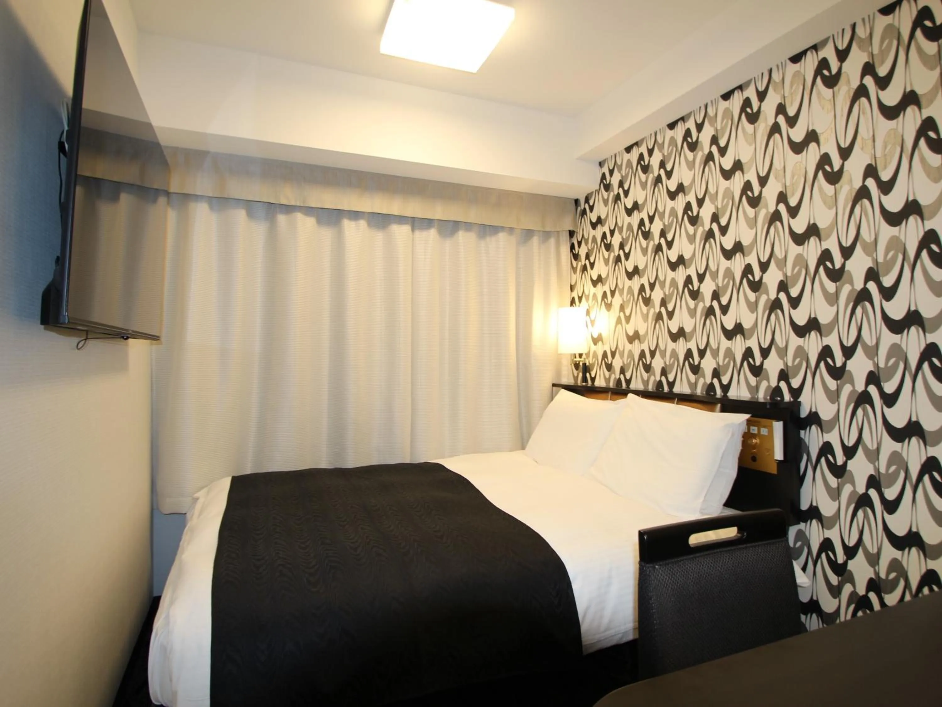 Photo of the whole room, Bed in APA Hotel Toyama Ekimae