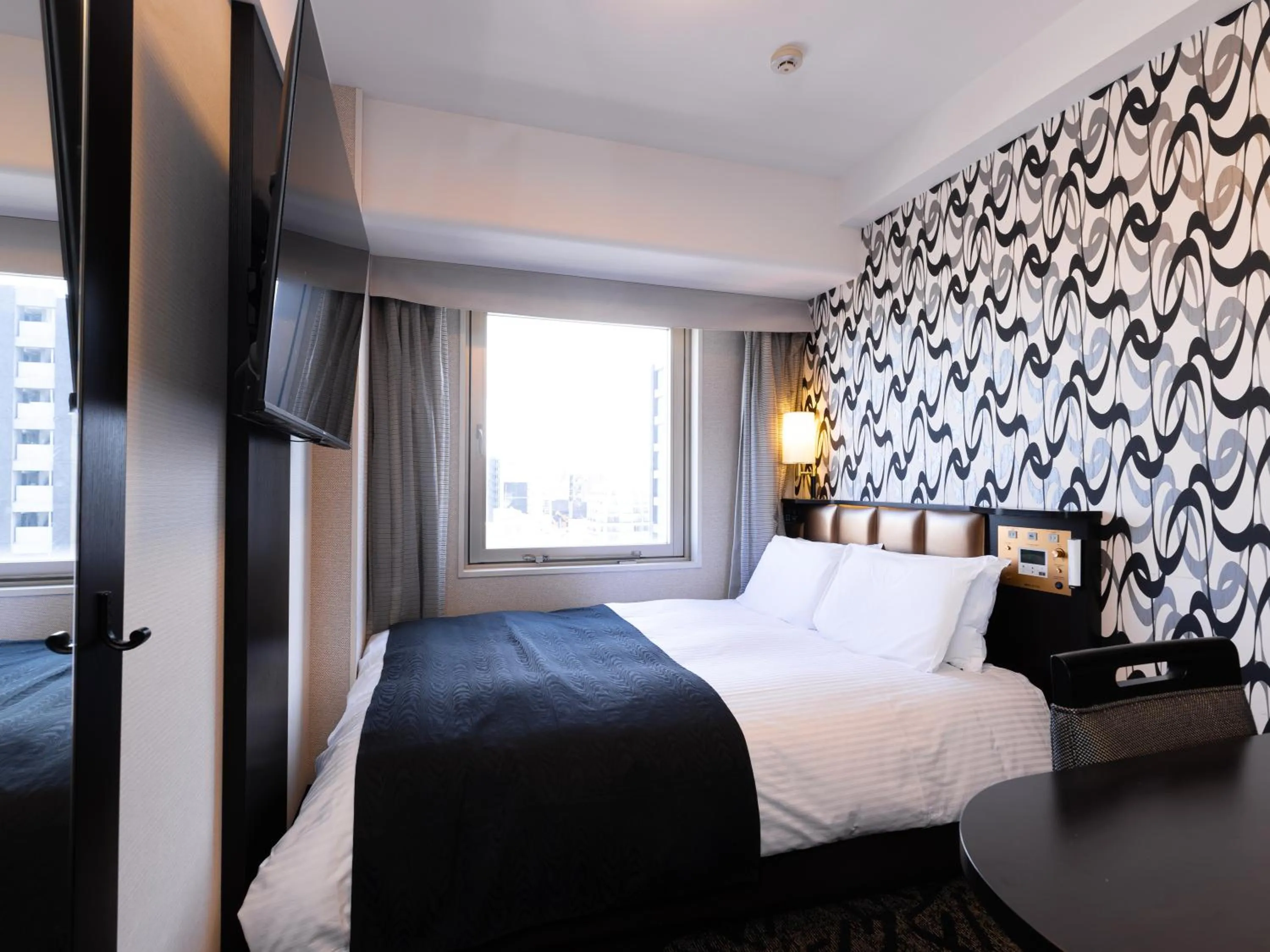 Photo of the whole room, Bed in APA Hotel Nagoya Sakae