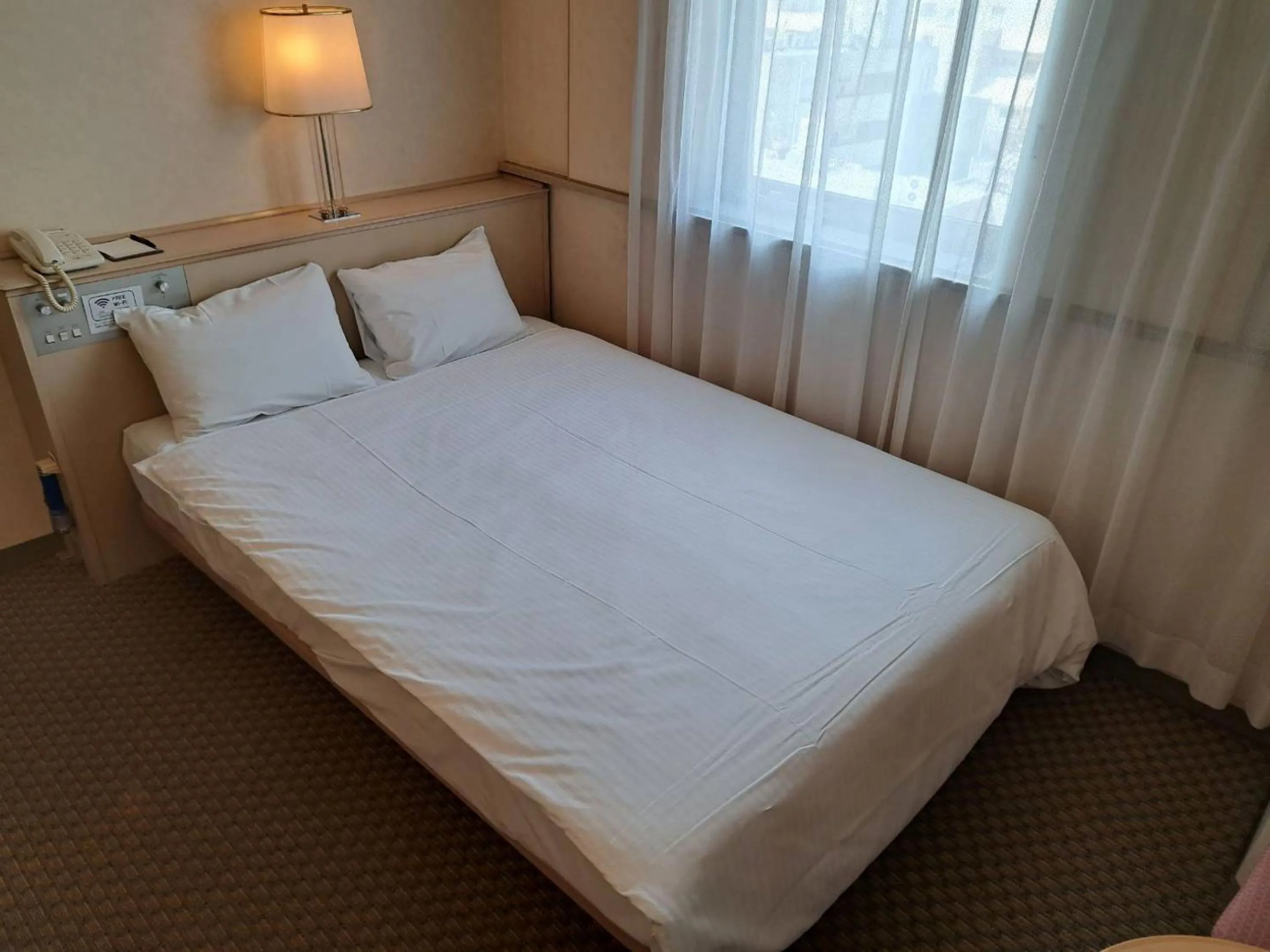 Photo of the whole room, Bed in Tabist Hotel Tetora Kitakyushu