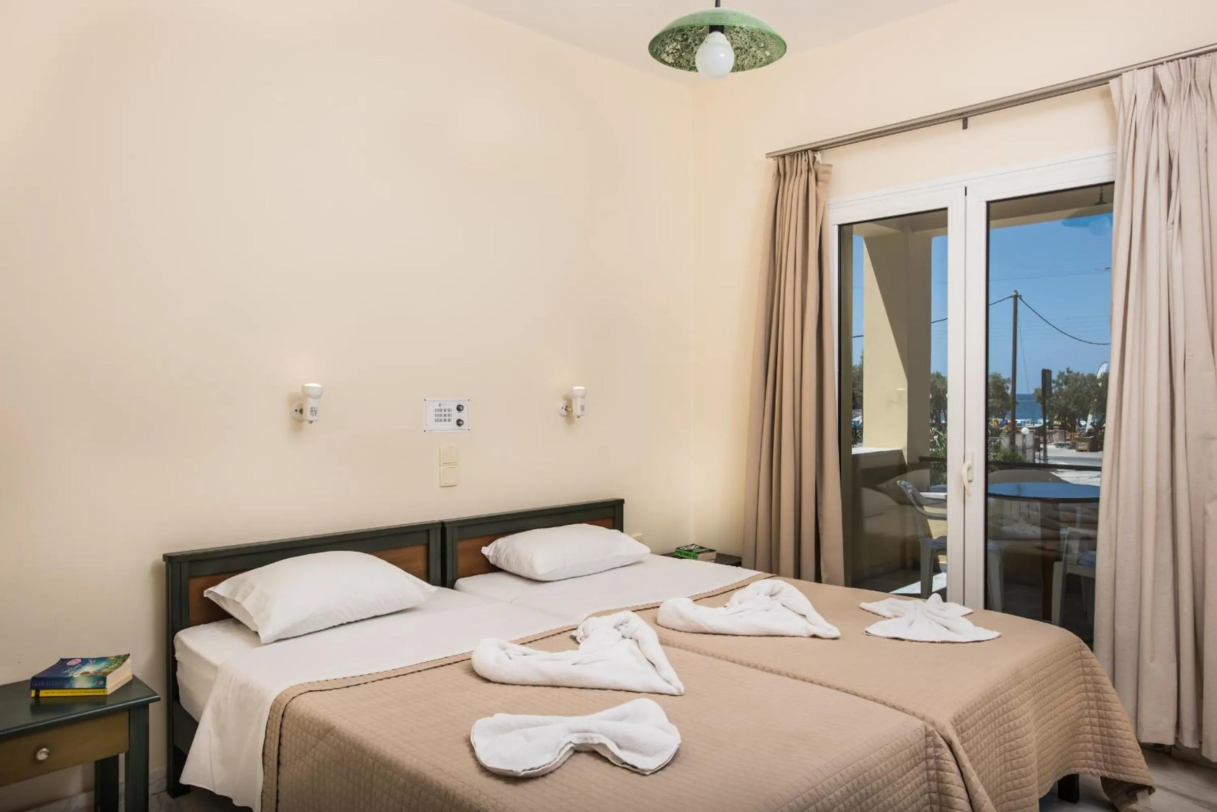 Bed in Mythos Beach Hotel Apartments