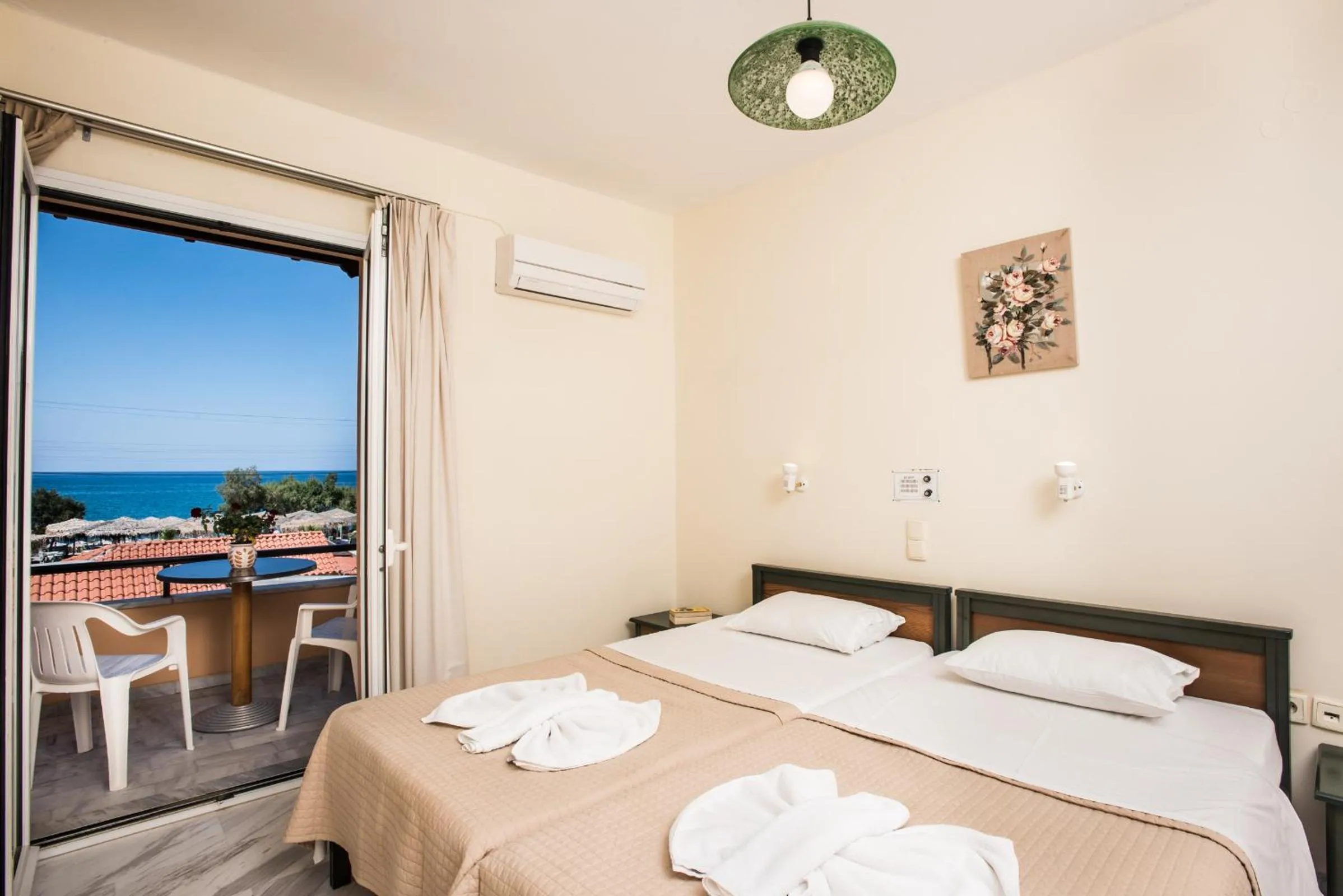 Bed in Mythos Beach Hotel Apartments