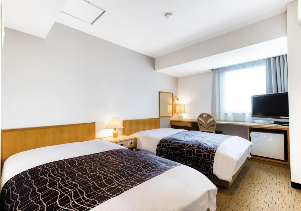 Photo of the whole room, Bed in APA Hotel Marugame Ekimae Odori