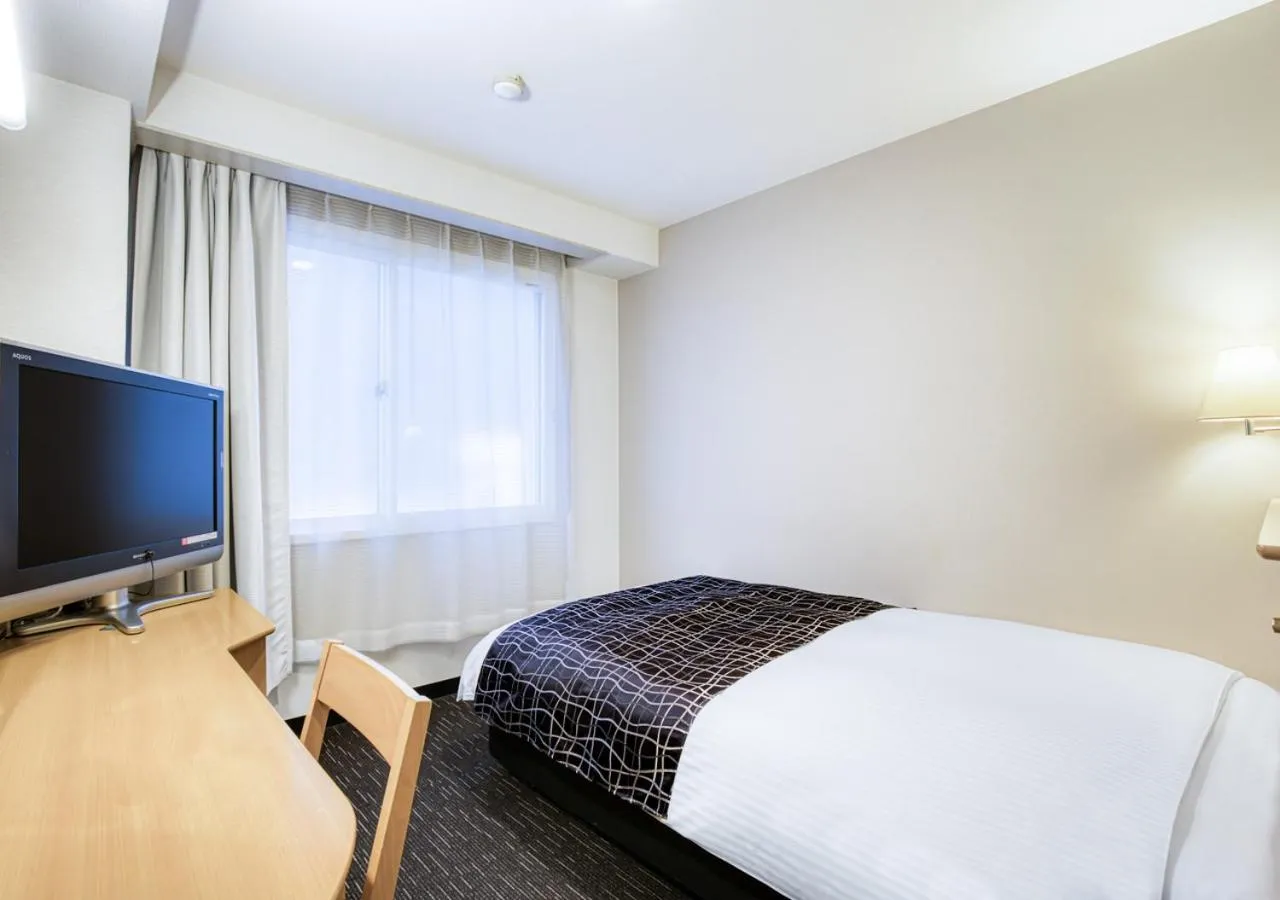 Photo of the whole room, Bed in APA Hotel Marugame Ekimae Odori