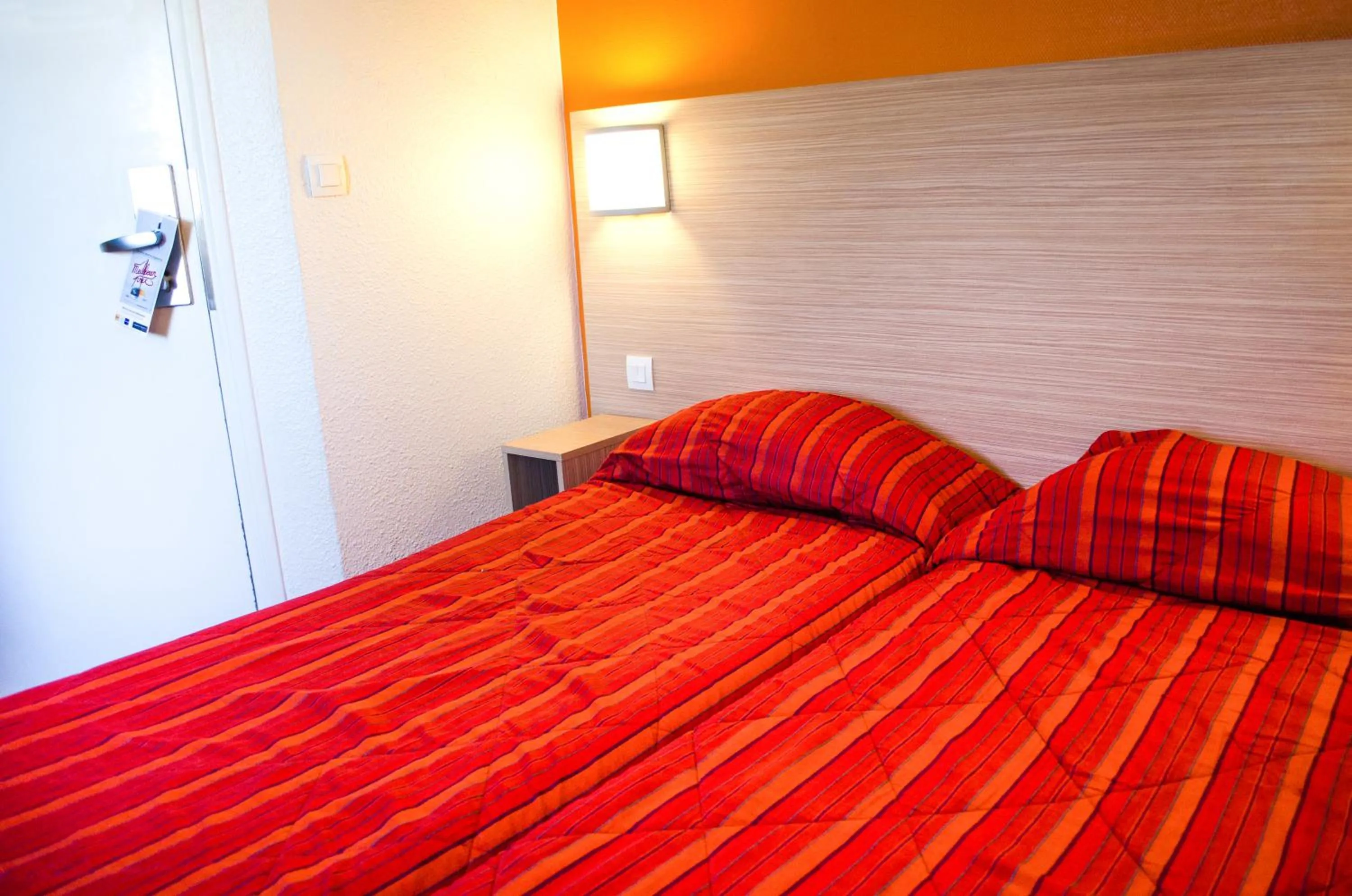 Bedroom in Hotel HECO Lyon sud Vienne