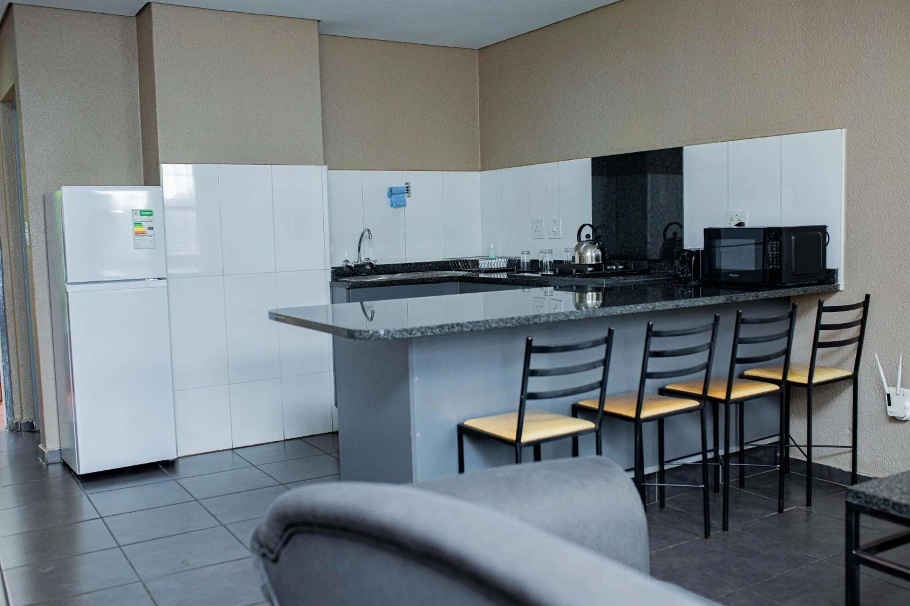 Kitchen or kitchenette in Vetho 2 Apartments OR Tambo Airport
