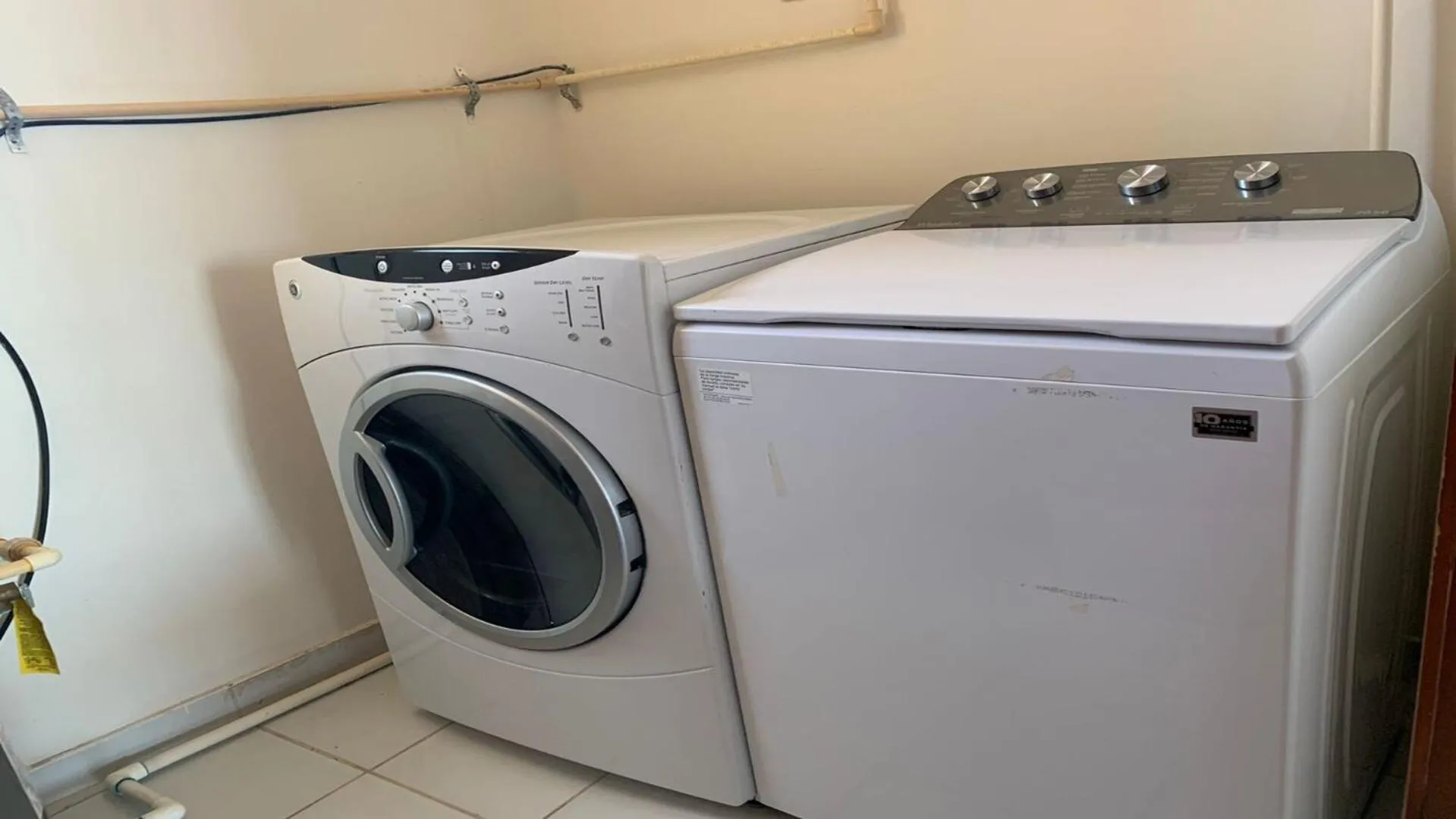 washing machine in Encanto Living Two Bedroom Unit by Kivoya
