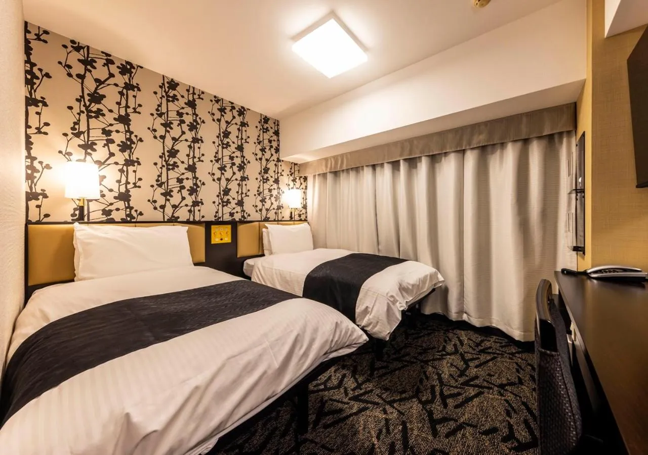 Photo of the whole room, Bed in APA Hotel Kanazawa Ekimae