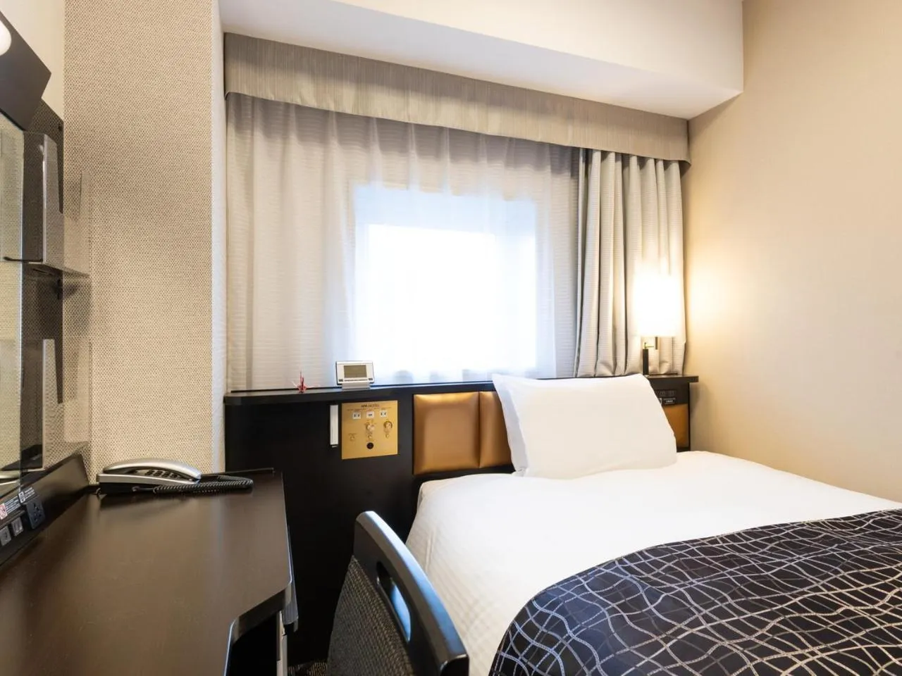 Bed in APA Hotel Kanazawa Ekimae