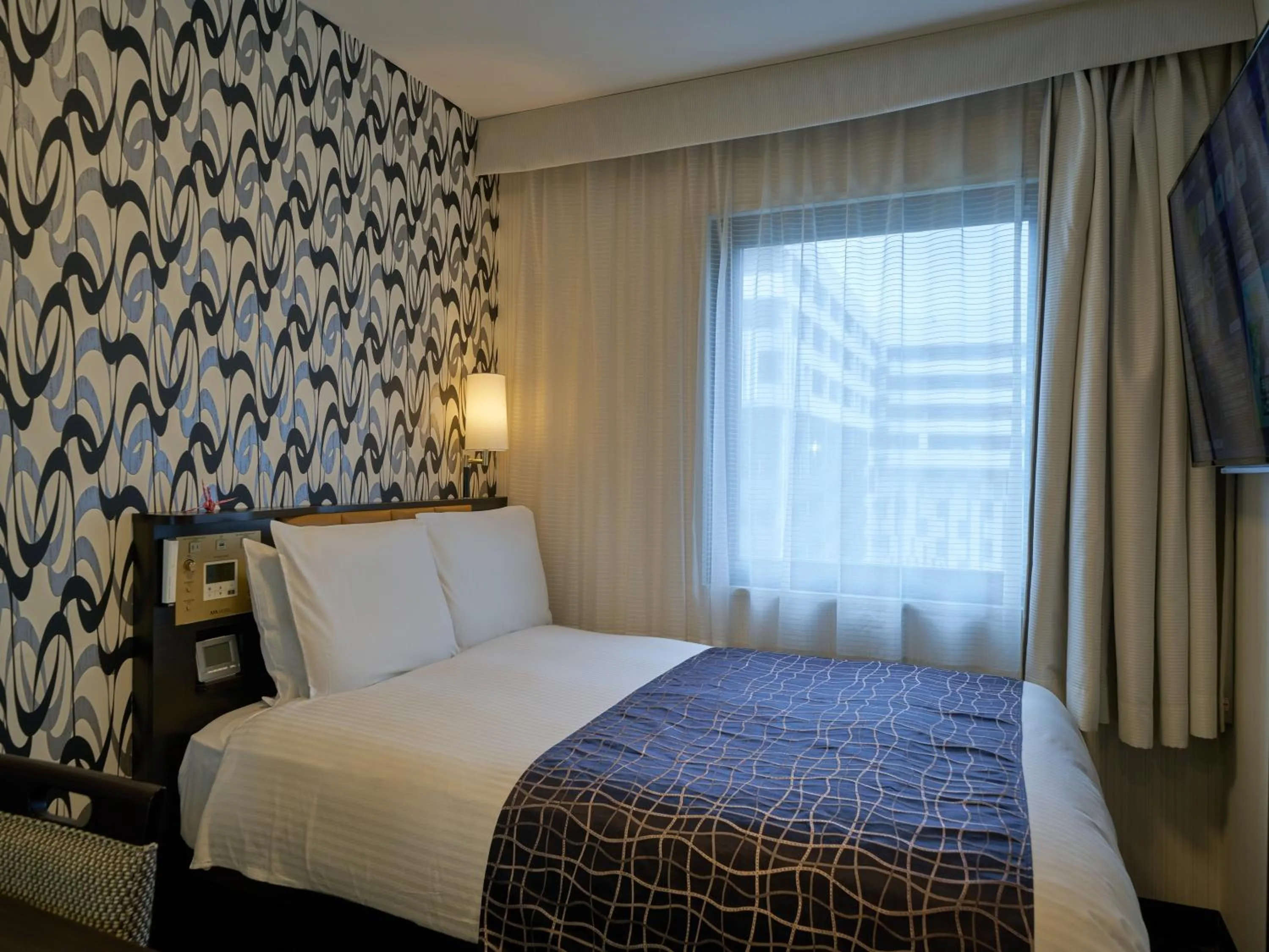 Photo of the whole room, Bed in APA Hotel Okayama Ekimae