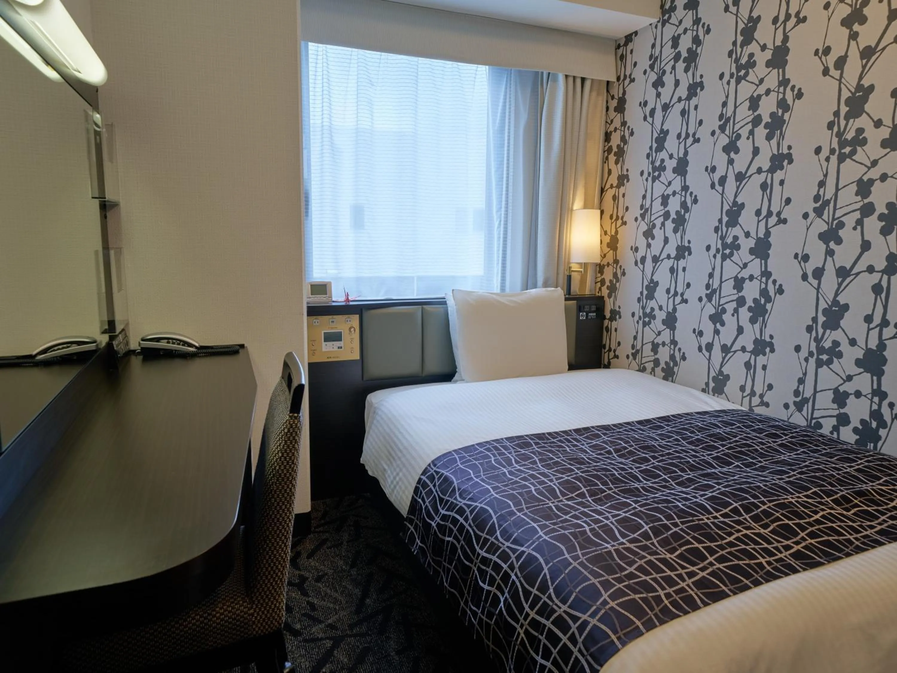 Photo of the whole room, Bed in APA Hotel Okayama Ekimae