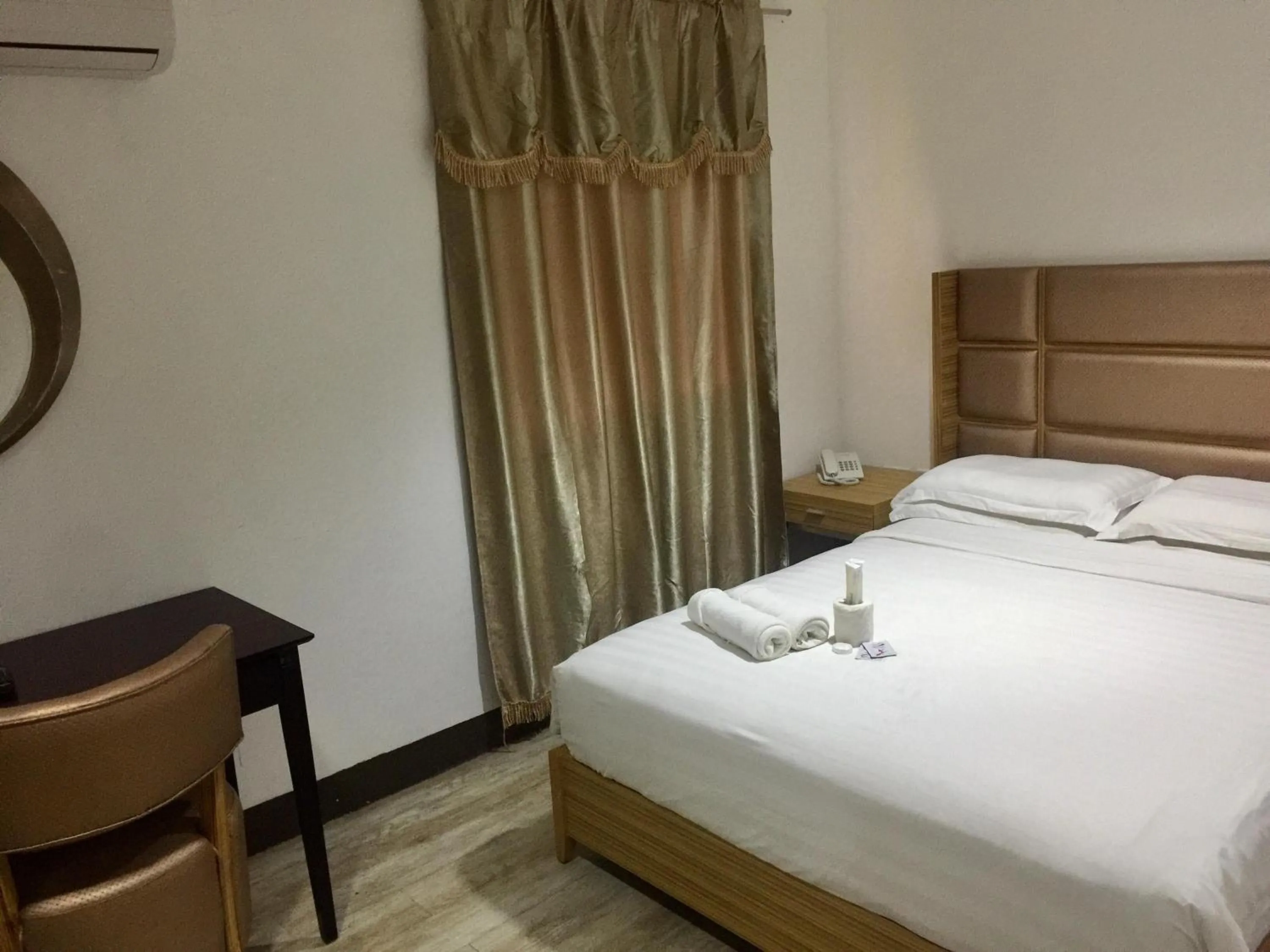 Bed in Jeamco Royal Hotel-Palawan
