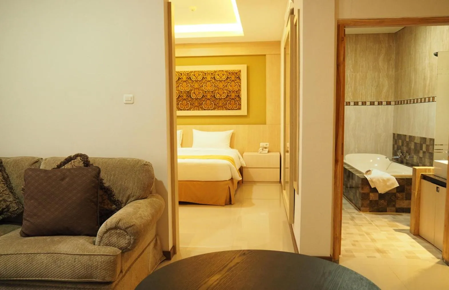 Living room, Bed in Luminor Hotel Banyuwangi By WH