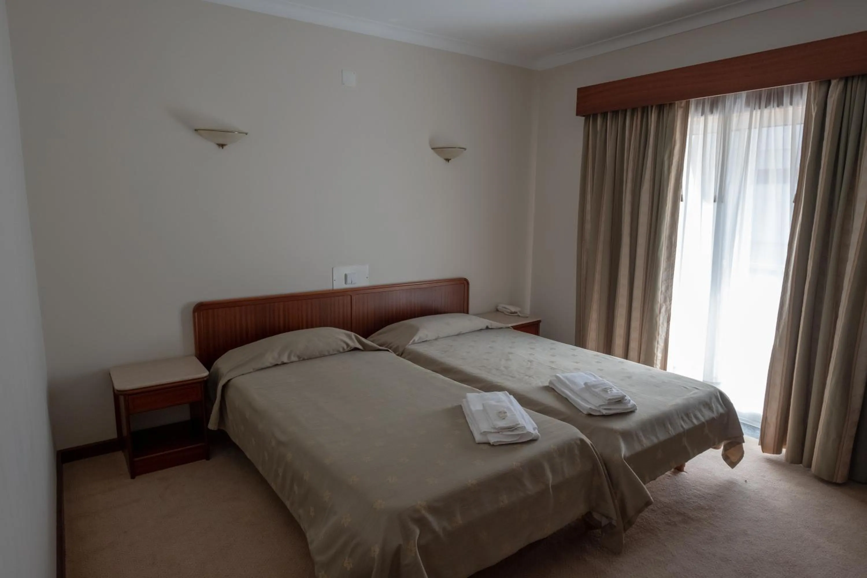 Bed in Hotel Peregrinos de Fatima by Umbral