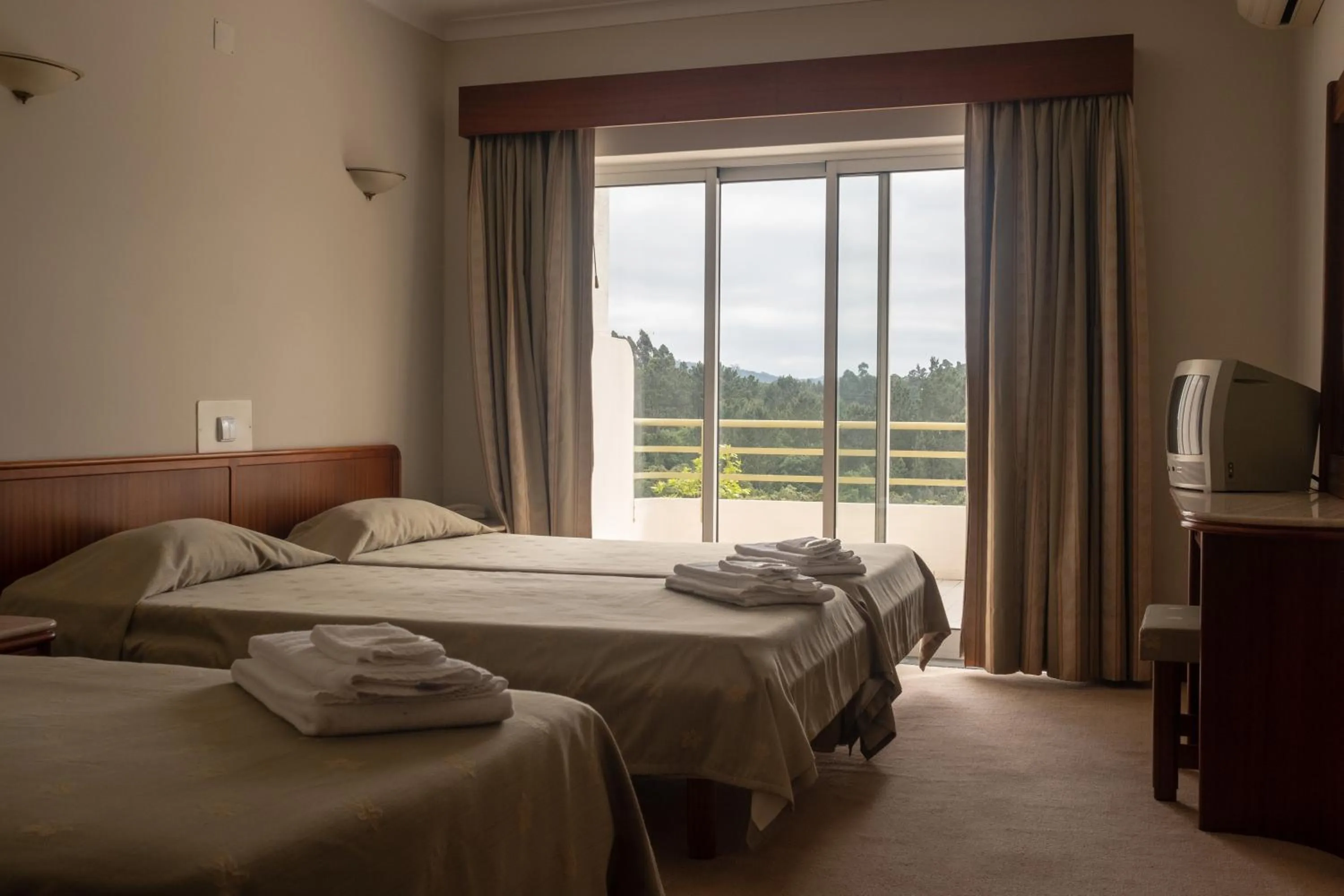 Bed in Hotel Peregrinos de Fatima by Umbral