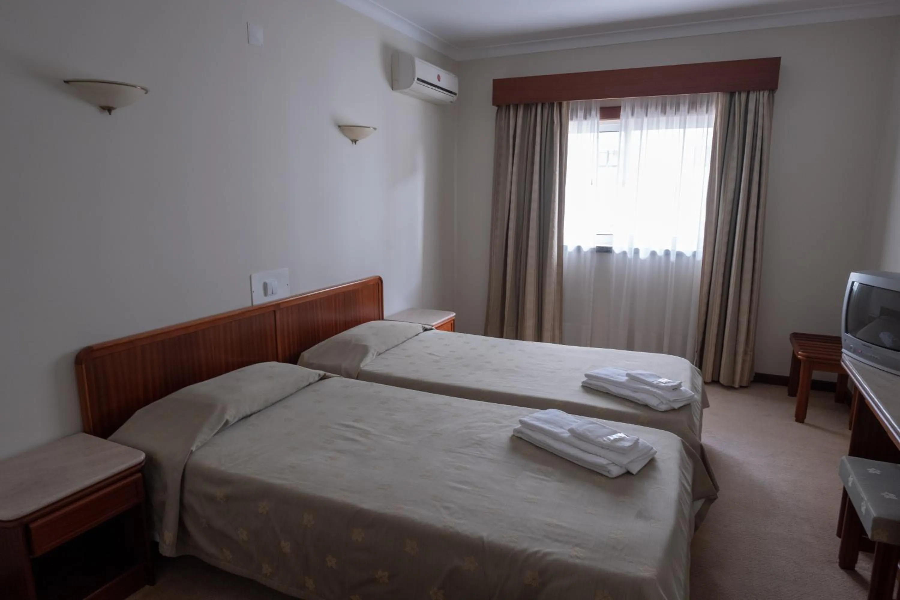 Bed in Hotel Peregrinos de Fatima by Umbral