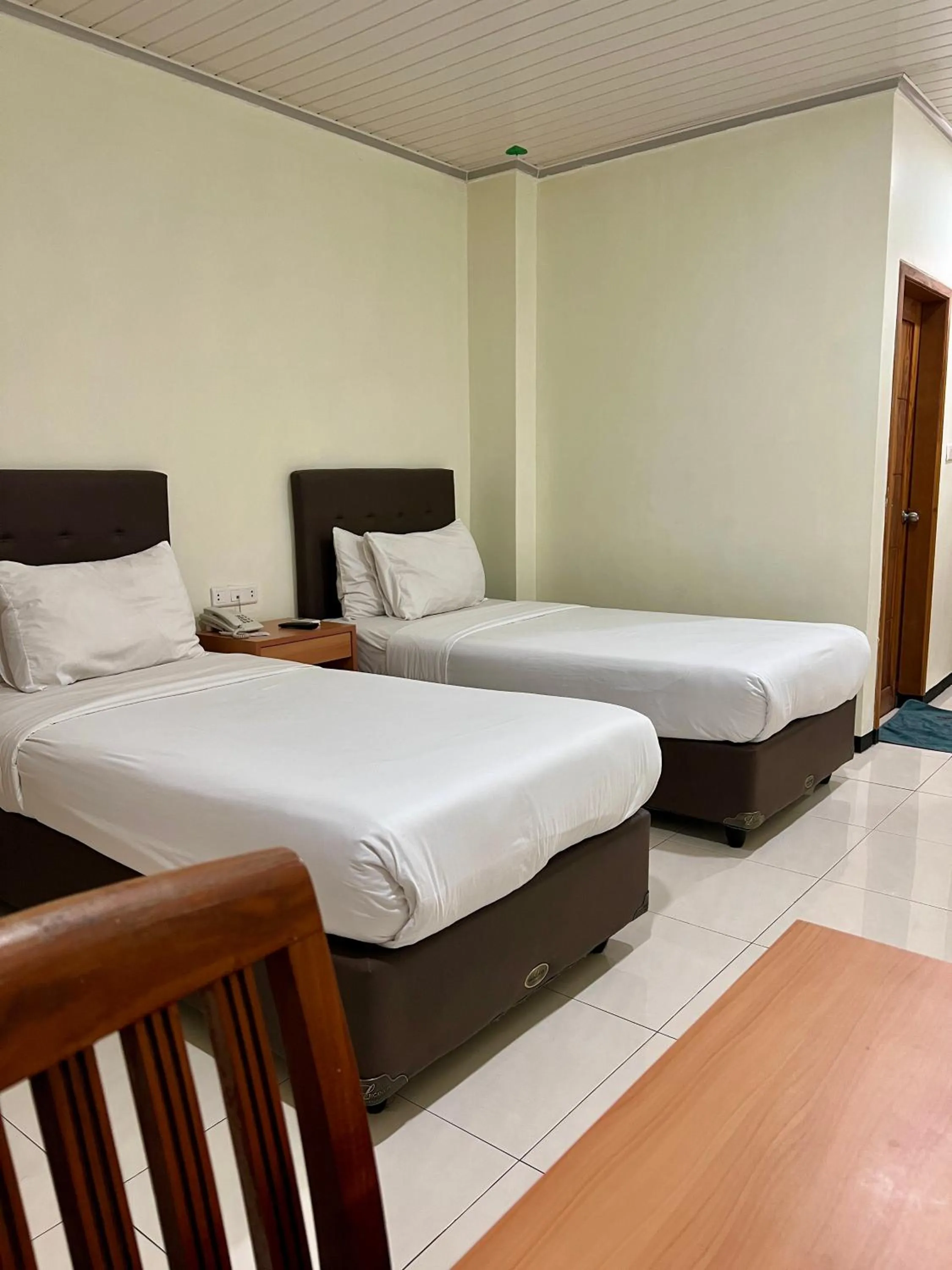 Bed in Aurora Hotel Siliwangi