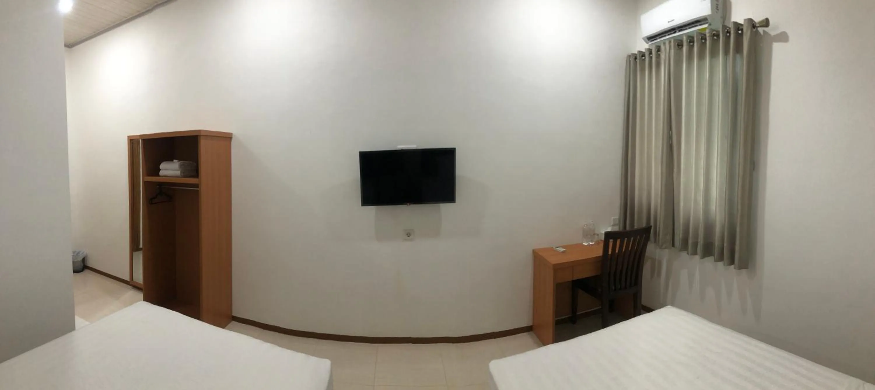 Bed in Aurora Hotel Siliwangi
