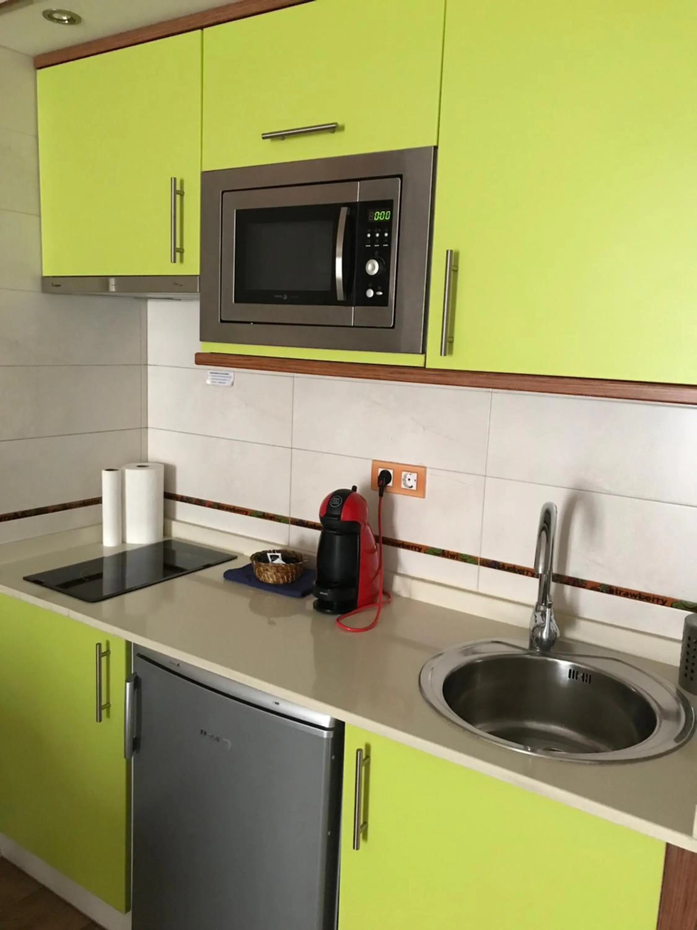 Kitchen or kitchenette in Apartahotel Tres Quiñones