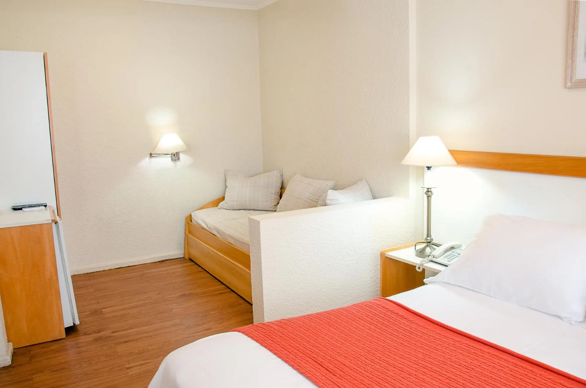 Bed in Hotel Sunset Beach