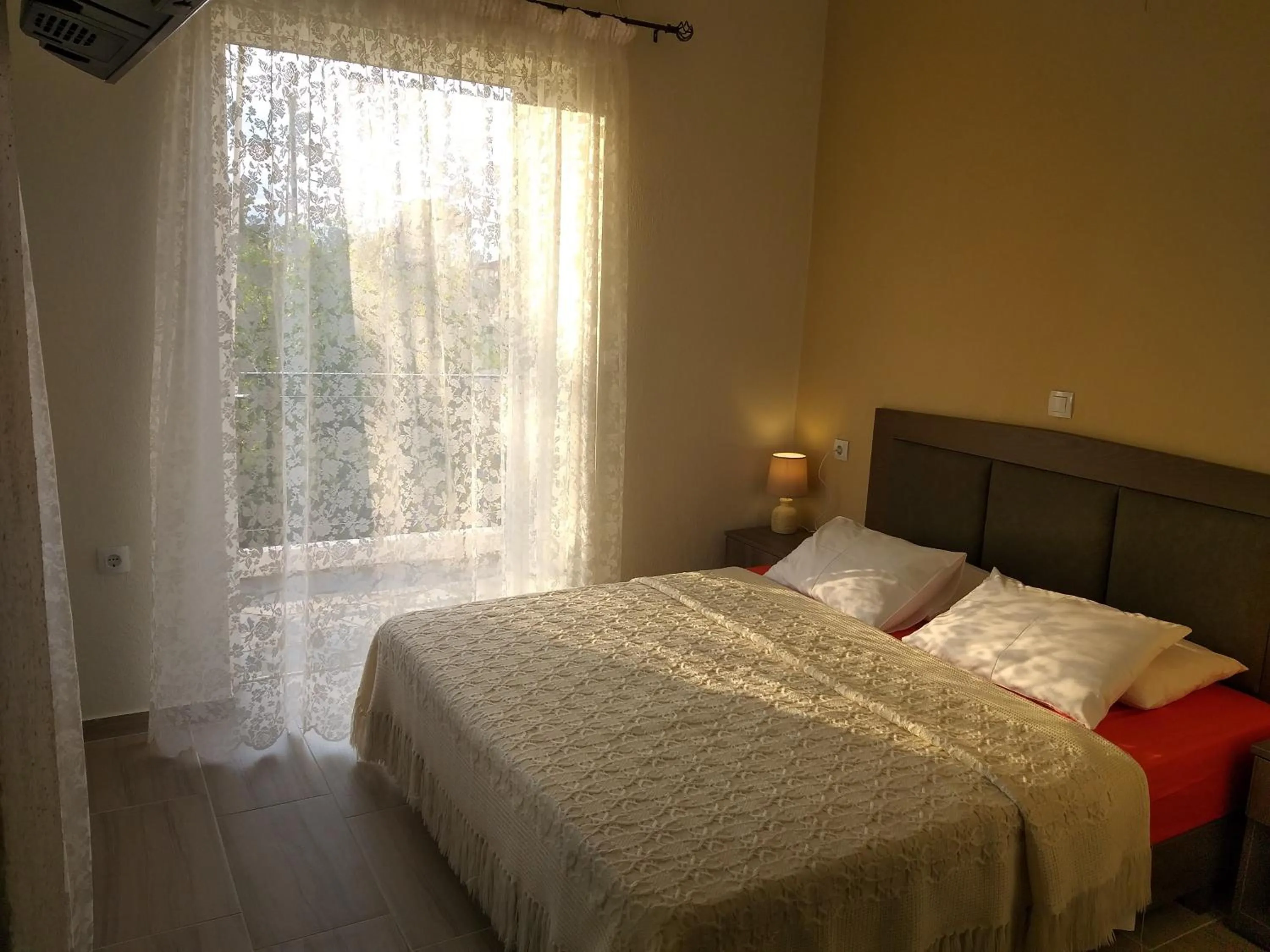 Bed in Nostos Apartments