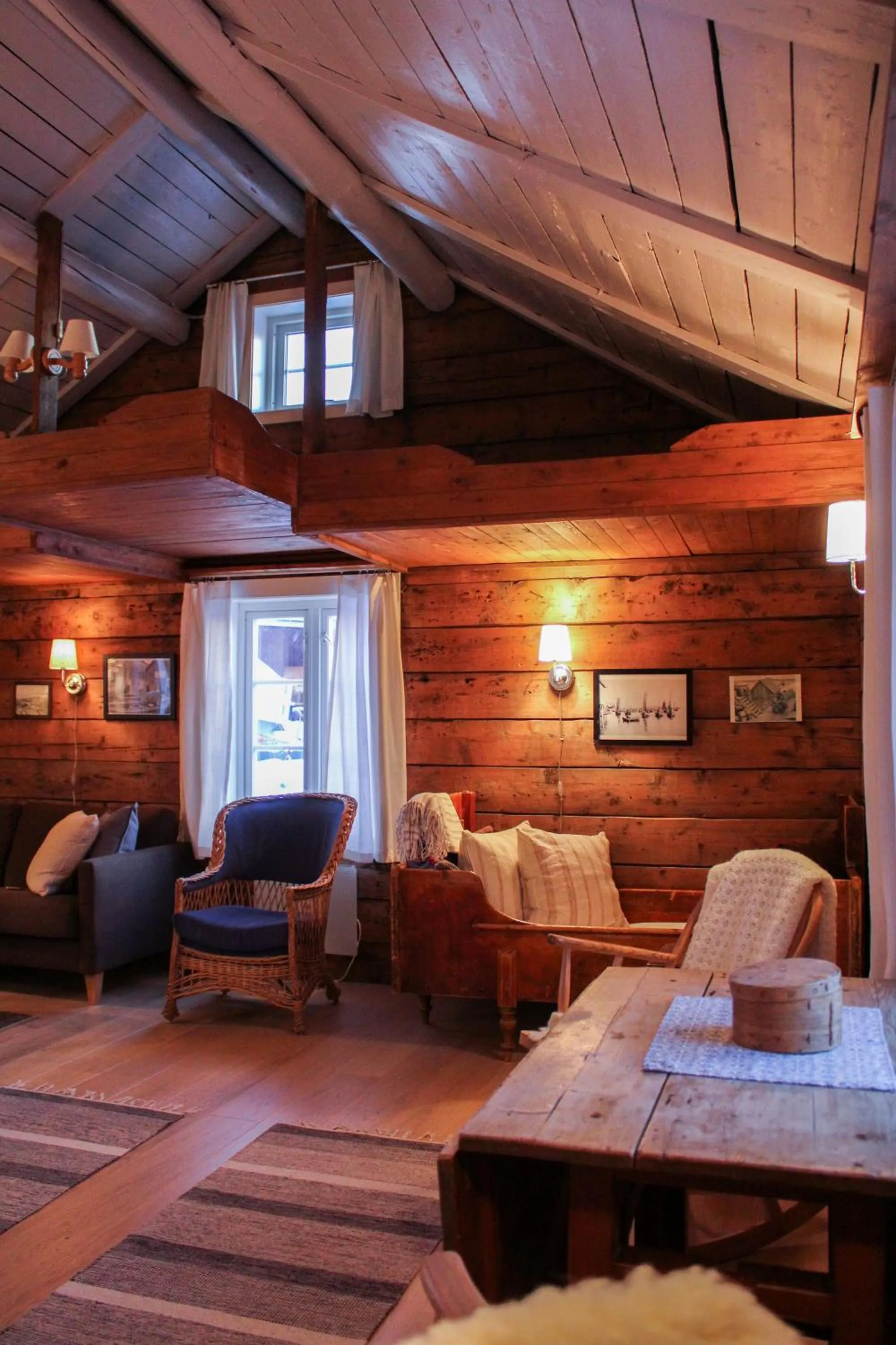 Living room, Bed in Å Rorbuer - by Classic Norway Hotels