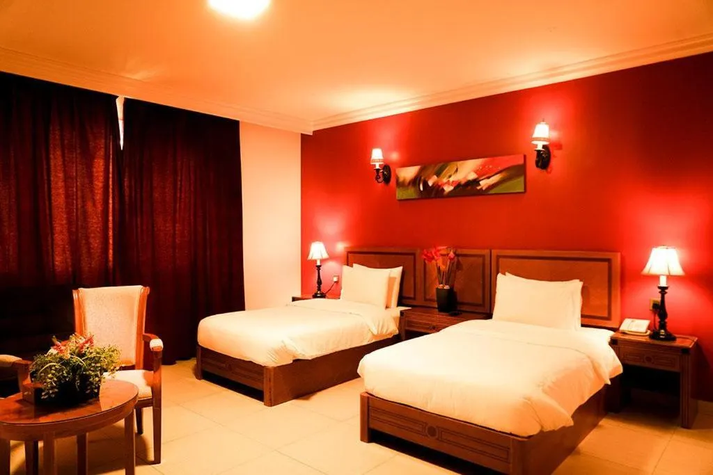 Bed in La Rosa Hotel Oman