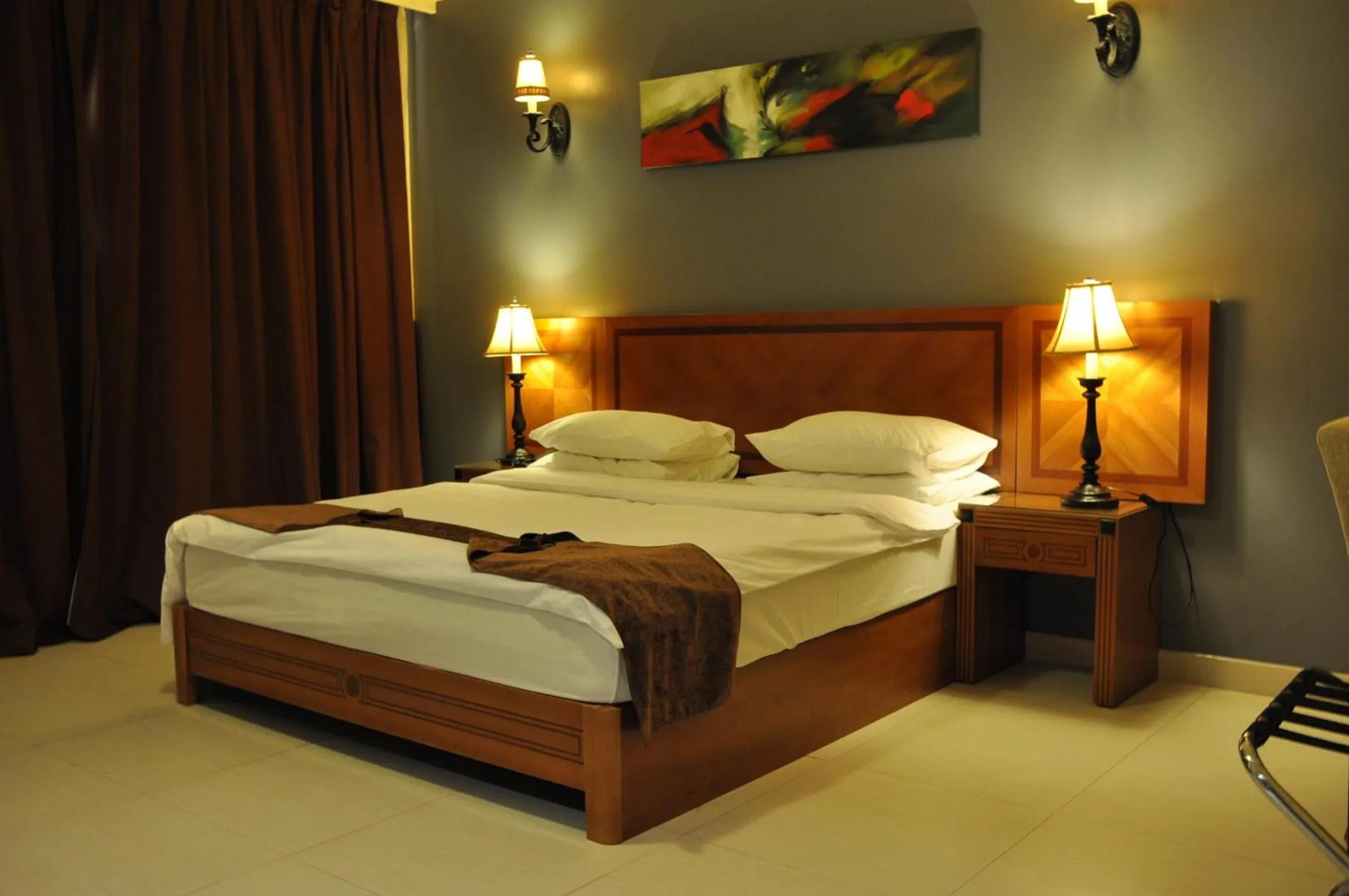 Bed in La Rosa Hotel Oman