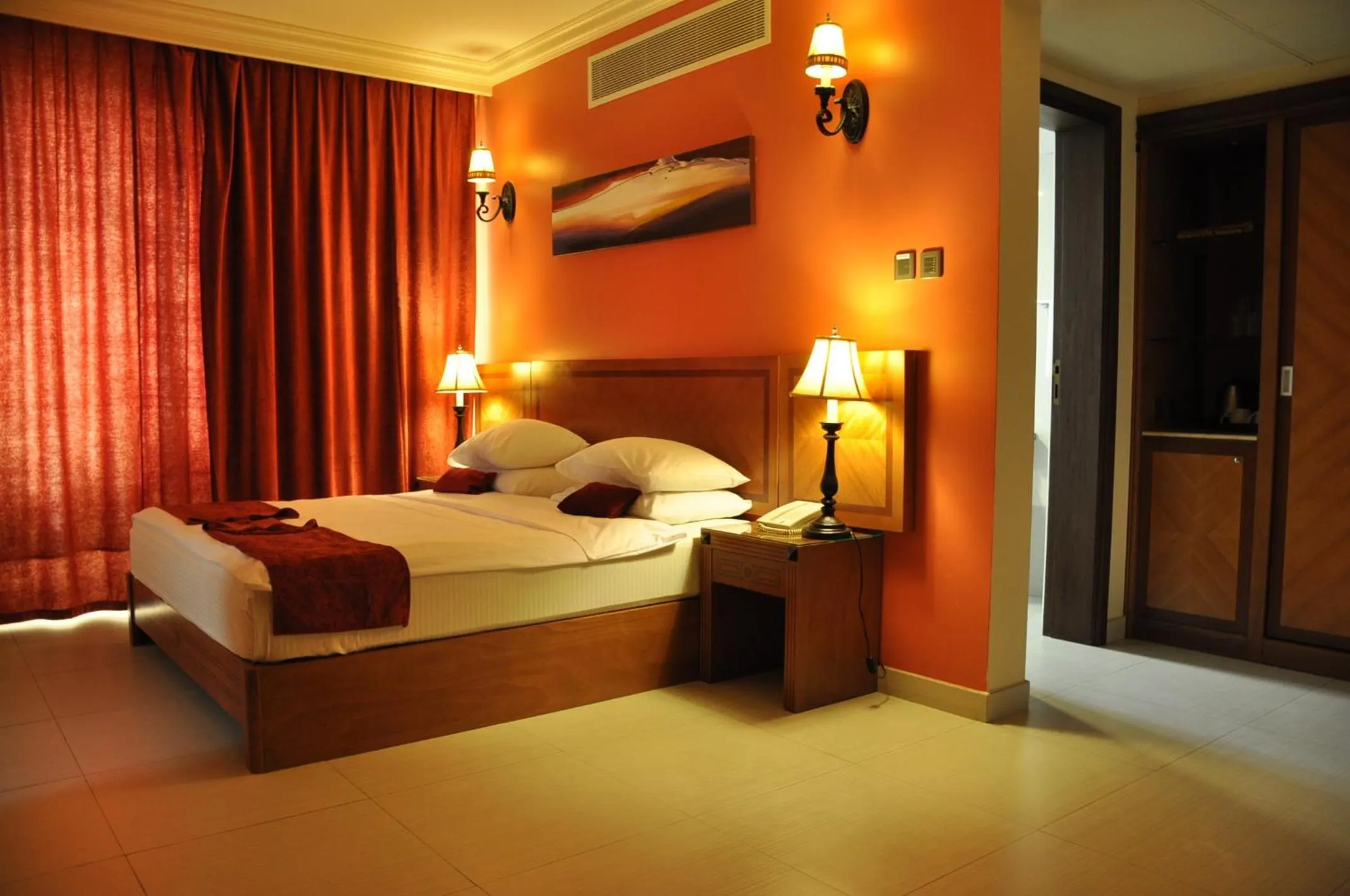 Bed in La Rosa Hotel Oman